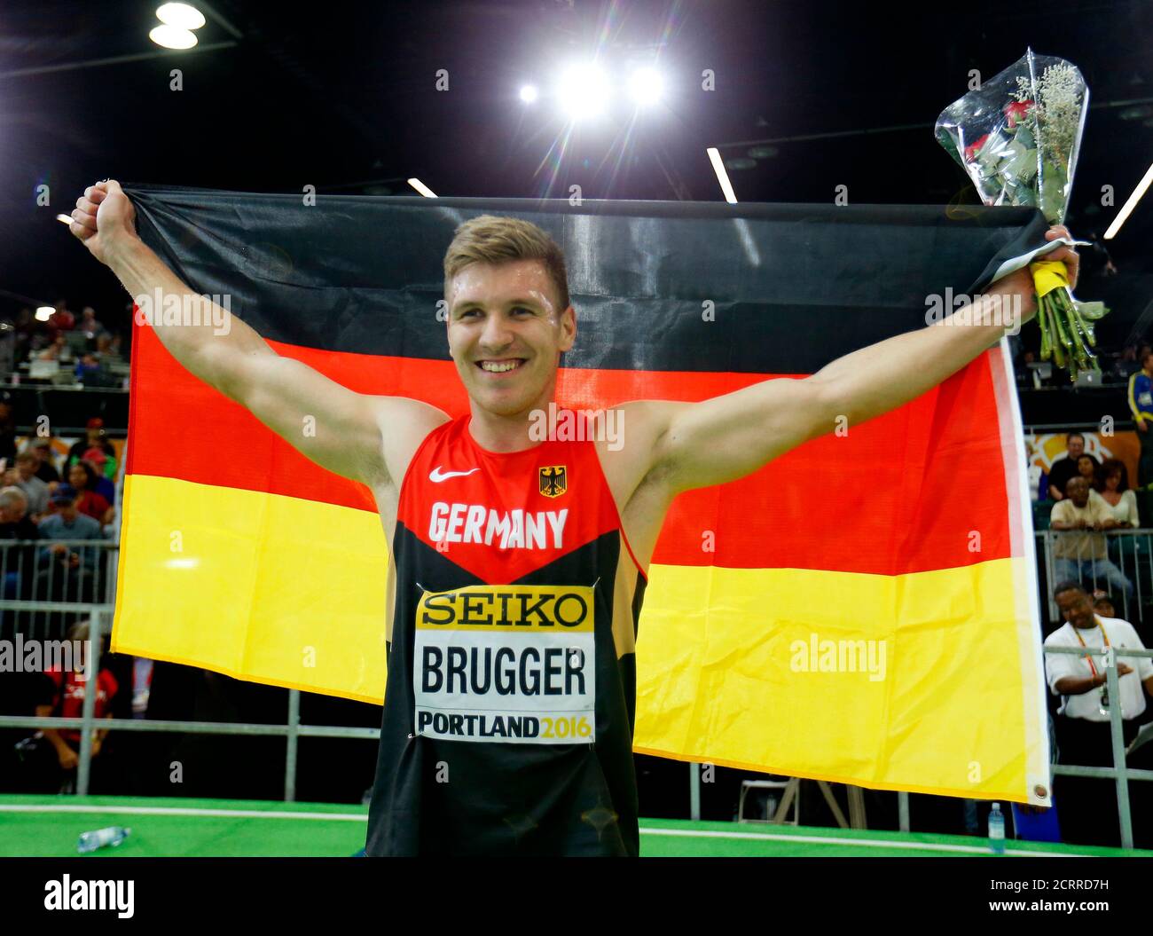 Mathias Brugger of Germany celebrates with his country's flag after winning the bronze medal in the men's heptathlon during the IAAF World Indoor Athletics Championships in Portland, Oregon March 19, 2016.  REUTERS/Mike Blake Stock Photo