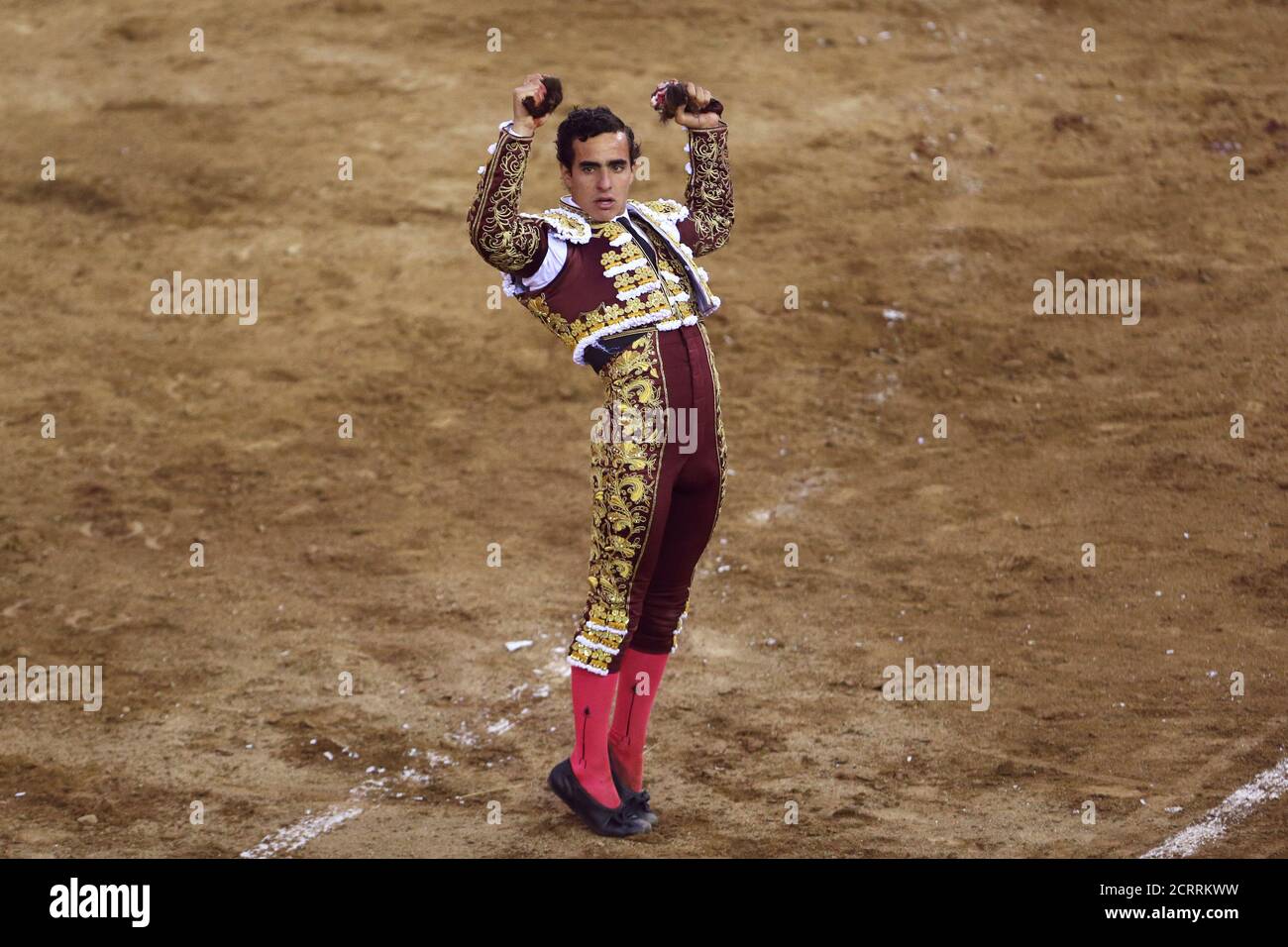 Peruvian bullfighter Joaquin Galdos celebrates with his trophy, two ears of a bull he killed, during a bullfight at Peru's historic Plaza de Acho bullring in Lima, November 5, 2017. REUTERS/Guadalupe Pardo Stock Photo