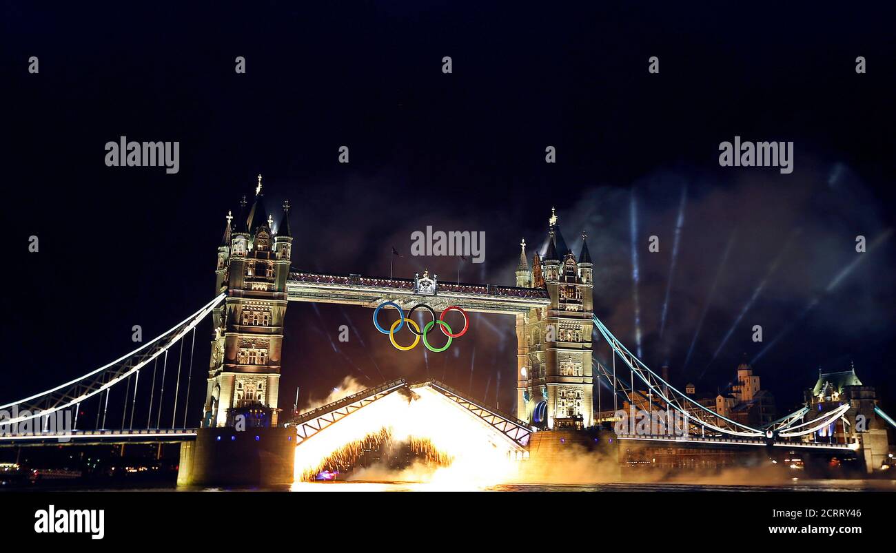 Fireworks and a light display light up Tower Bridge in central London to mark the opening of the London 2012 Olympic Games July 27, 2012.    REUTERS/Stefano Rellandini    (BRITAIN - Tags: SPORT OLYMPICS CITYSPACE TPX IMAGES OF THE DAY) Stock Photo