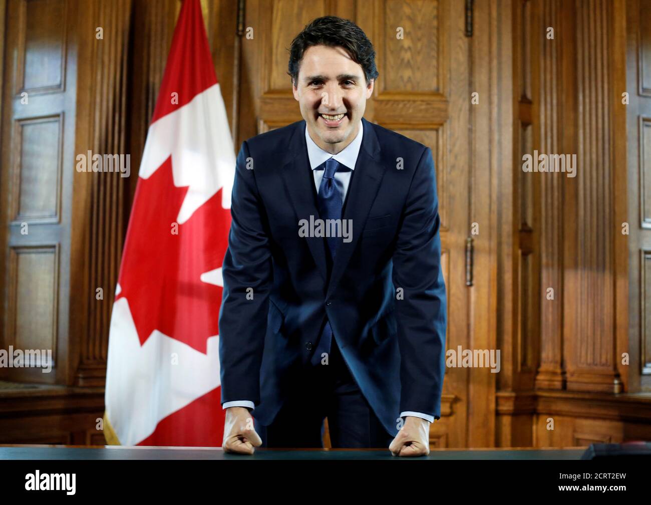 Canada's Prime Minister Justin Trudeau poses at his desk following an interview with Reuters in his office on Parliament Hill in Ottawa, Ontario, Canada, May 19, 2016. REUTERS/Chris Wattie Stock Photo