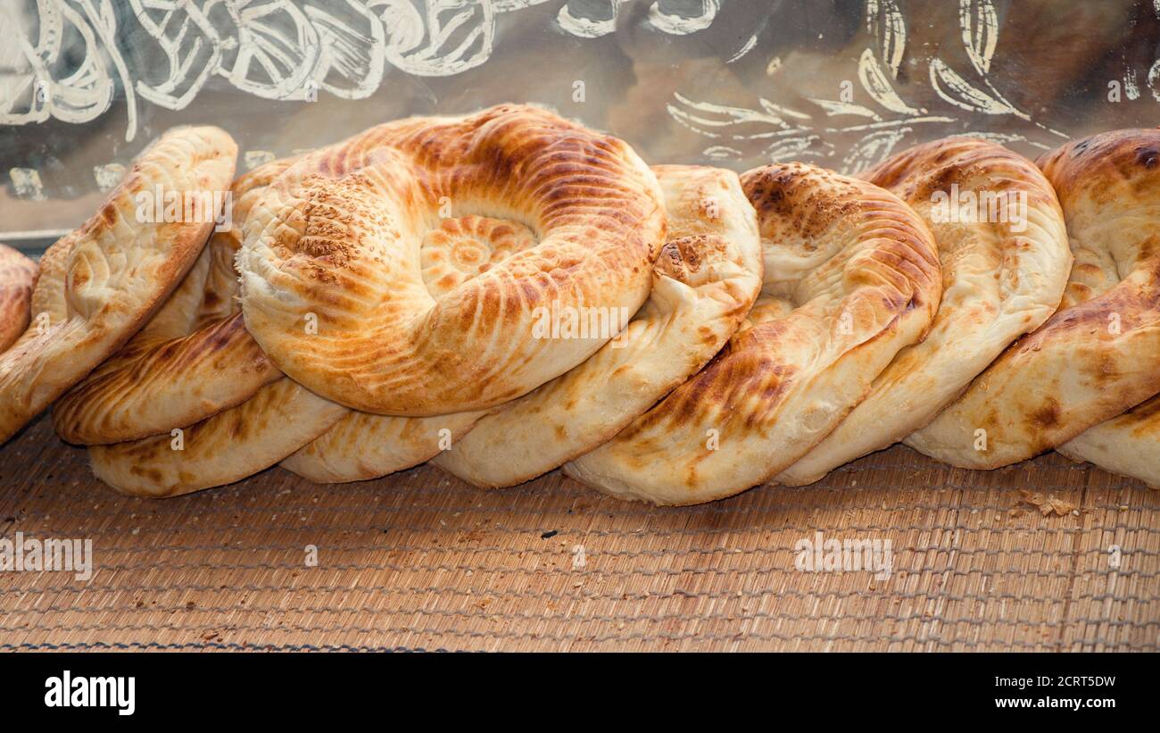 Typical flatbread with crunchy crust just baked in tandoor on market display of old bakery
