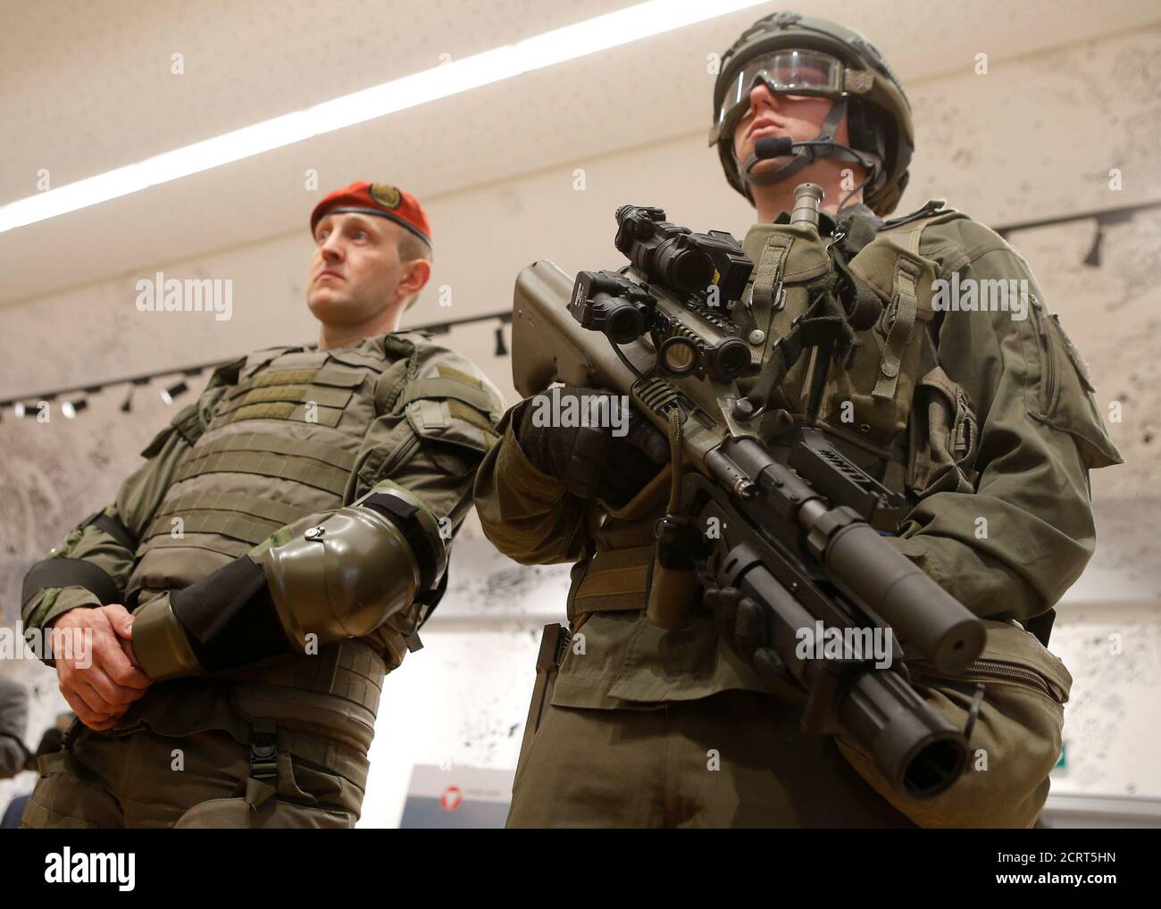 An Austrian army soldier poses with a Steyr AUG A2 Commando assault rifle  during a presentation