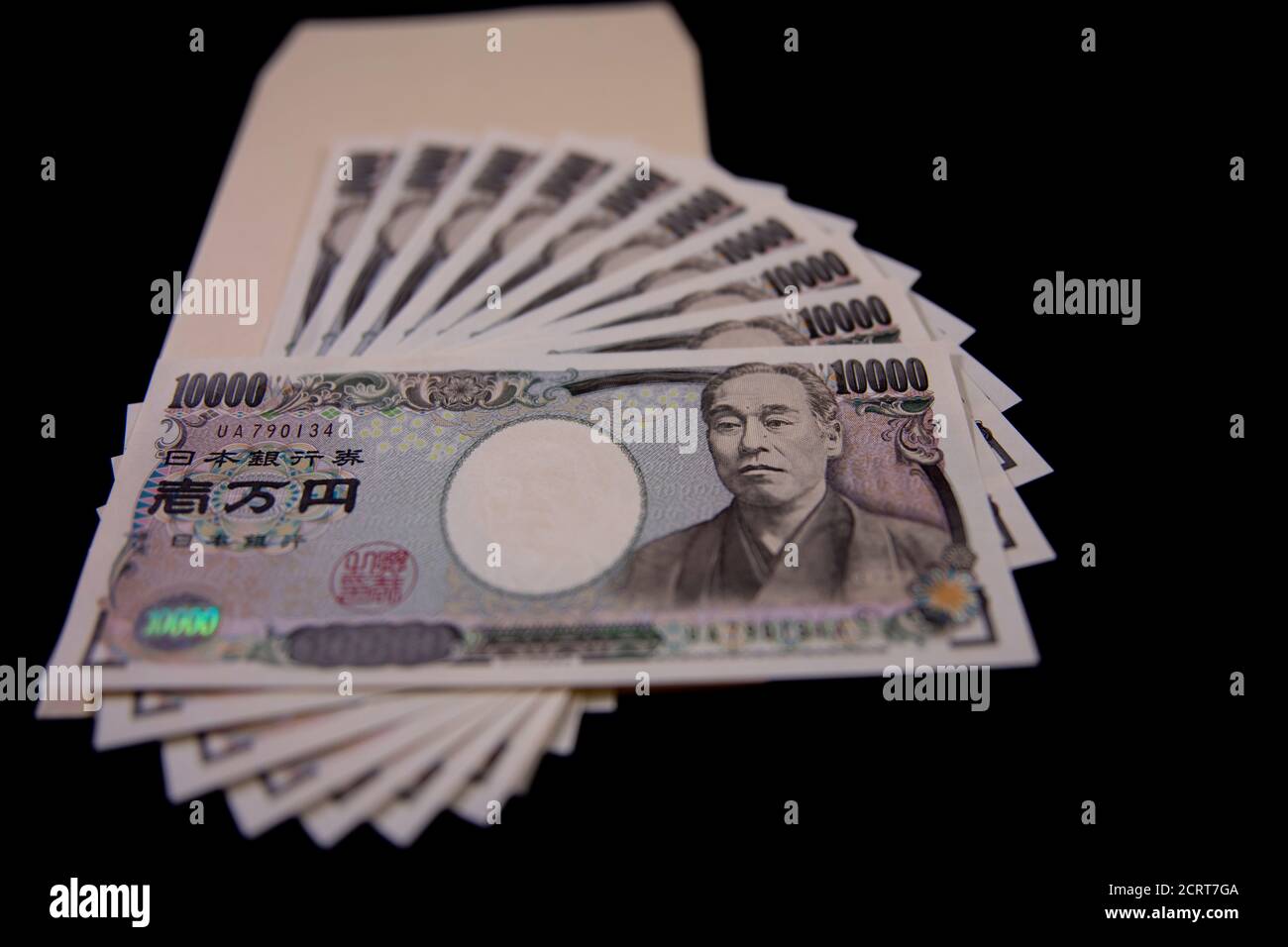 Japanese currency 100,000 yen with envelope on the black background Stock  Photo - Alamy