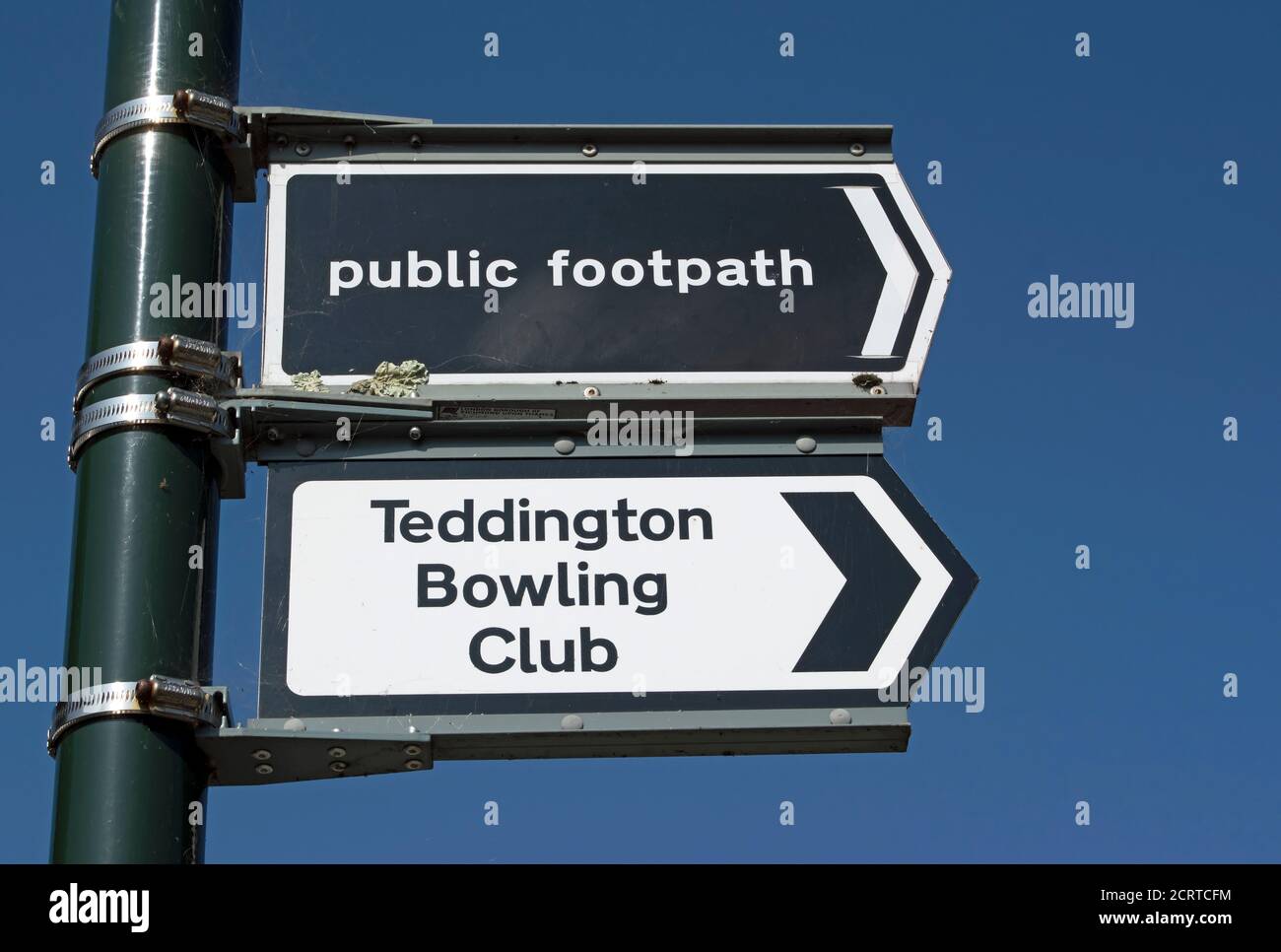 lamppost with right pointing signs for a public footpath and teddington bowling club, teddington, middlesex, england Stock Photo