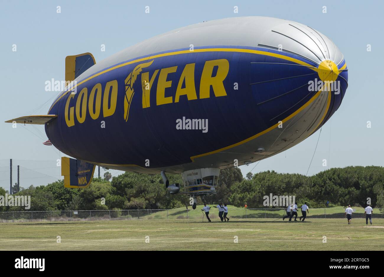 Grounds grew secure the Goodyear blimp ' Spirit of America' as it lands in Carson, California August 5, 2015. Christened in 2002, the air ship is being retired after 8,000 flights and replaced with a newer more modern version named the  â€œSpirit of Innovationâ€? in September.    REUTERS/Mike Blake Stock Photo