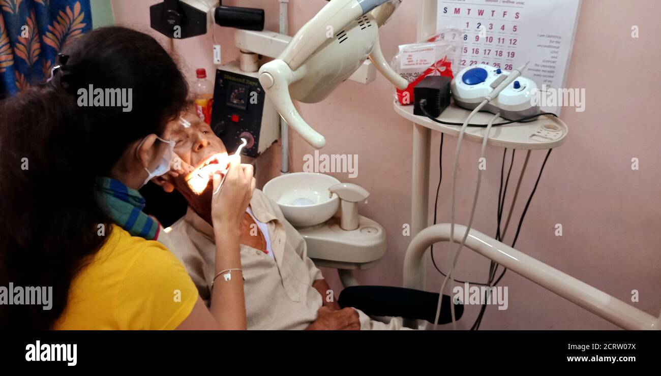 DISTRICT KATNI, INDIA SEPTEMBER 29, 2019 An indian female dentist checking oral infection at