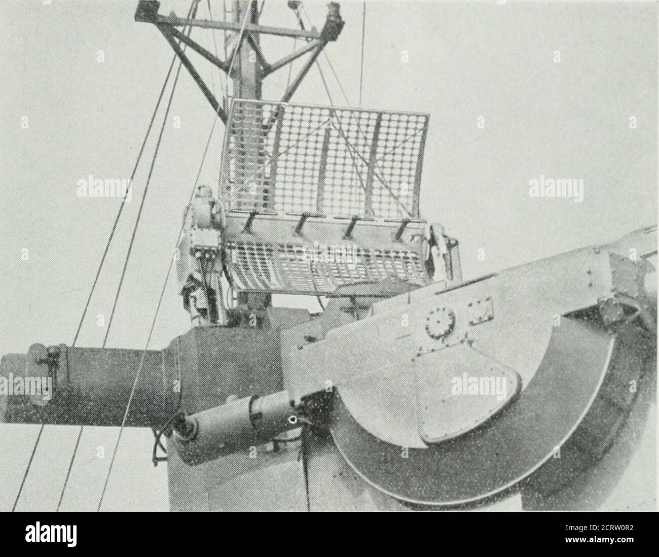 . The Bell System technical journal . similar in appearance tothe Main Unit of Radar Mark 1 shown in Fig. 9. Two types of antennas were provided for this radar: a 6 ft. by 6 ft.parabolic array similar to the Mark 1 antenna, and a 3 ft. by 12 ft. parabolicarray. Either one or the other of these antennas was mounted on top ofthe gun director and rotated with it in azimuth. Both were provided withazimuth lobe switching to be described later. Because of the relativelynarrow elevation beam of the 6 ft. by 6 ft. array, this antenna required gyro FIRE-CONTROL R.DARS FOR NAVAL VESSELS 23 stabilizatio Stock Photo