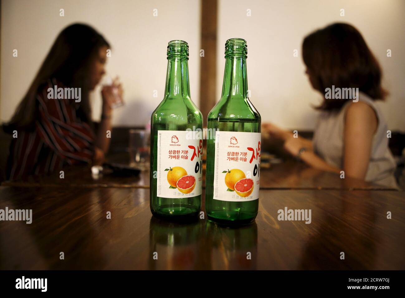 Bottles of fruit flavoured and low-alcohol soju are seen in this picture  illustration at a pub in Seoul, South Korea, September 9, 2015.  Professional women are driving a change in the way