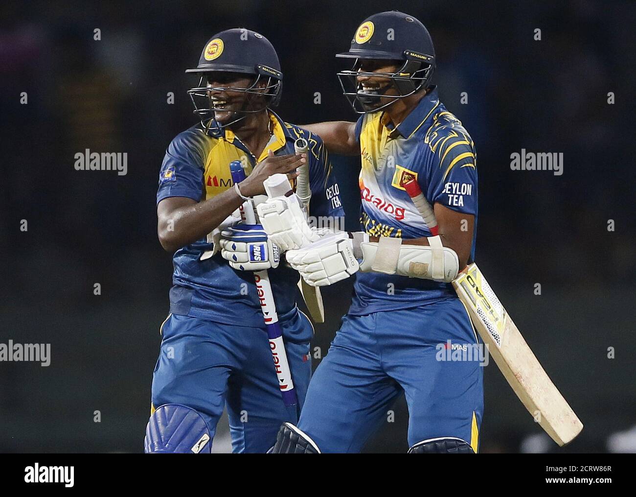 Sri Lanka's Ajantha Mendis (L) and 
