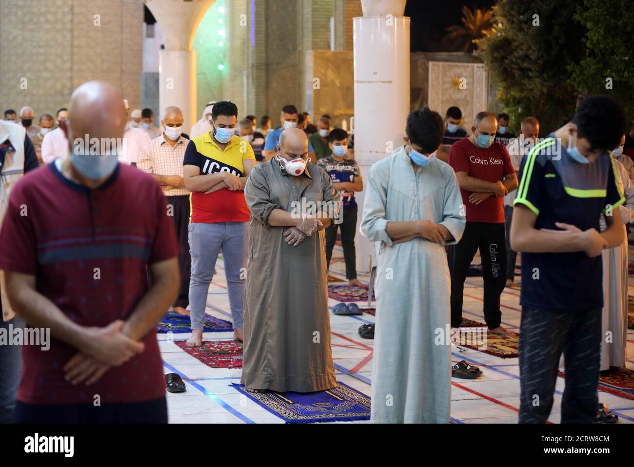Baghdad. 20th Sep, 2020. People offer prayers at a mosque in Baghdad, Iraq on Sept. 20, 2020. The Iraqi Higher Committee for Health and National Safety decided on Saturday to reopen mosques and amusement parks on condition that health prevention measures are strictly followed and social distancing rules maintained. Credit: Xinhua/Alamy Live News Stock Photo