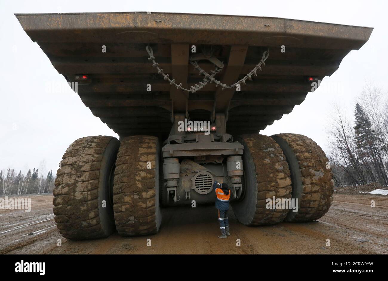 A crew member operating a BelAZ 75710 truck works at a parking of the  'Chernigovets' coal company, outside the town of Beryozovsky, Kemerovo  region, Siberia, Russia, April 4, 2016. Belarusian made world's