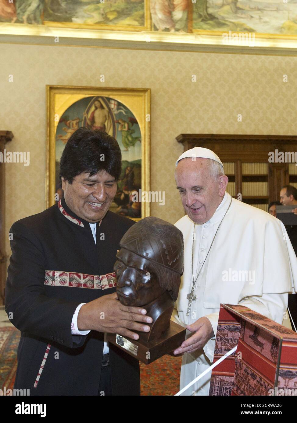 Bolivia's President Evo Morales (L) presents Pope Francis with a  handcrafted bust of Bolivia's indigenous leader Tupac Katari during a  meeting at the Vatican April 15, 2016. REUTERS/Alessandra Tarantino/Pool  Stock Photo -