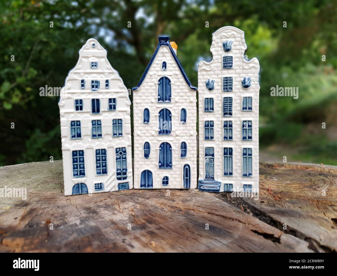 Close-up of three blue Dutch Delftware canal houses made of porcelain and hand painted, typical Dutch export product, selective focus and copy space. Stock Photo