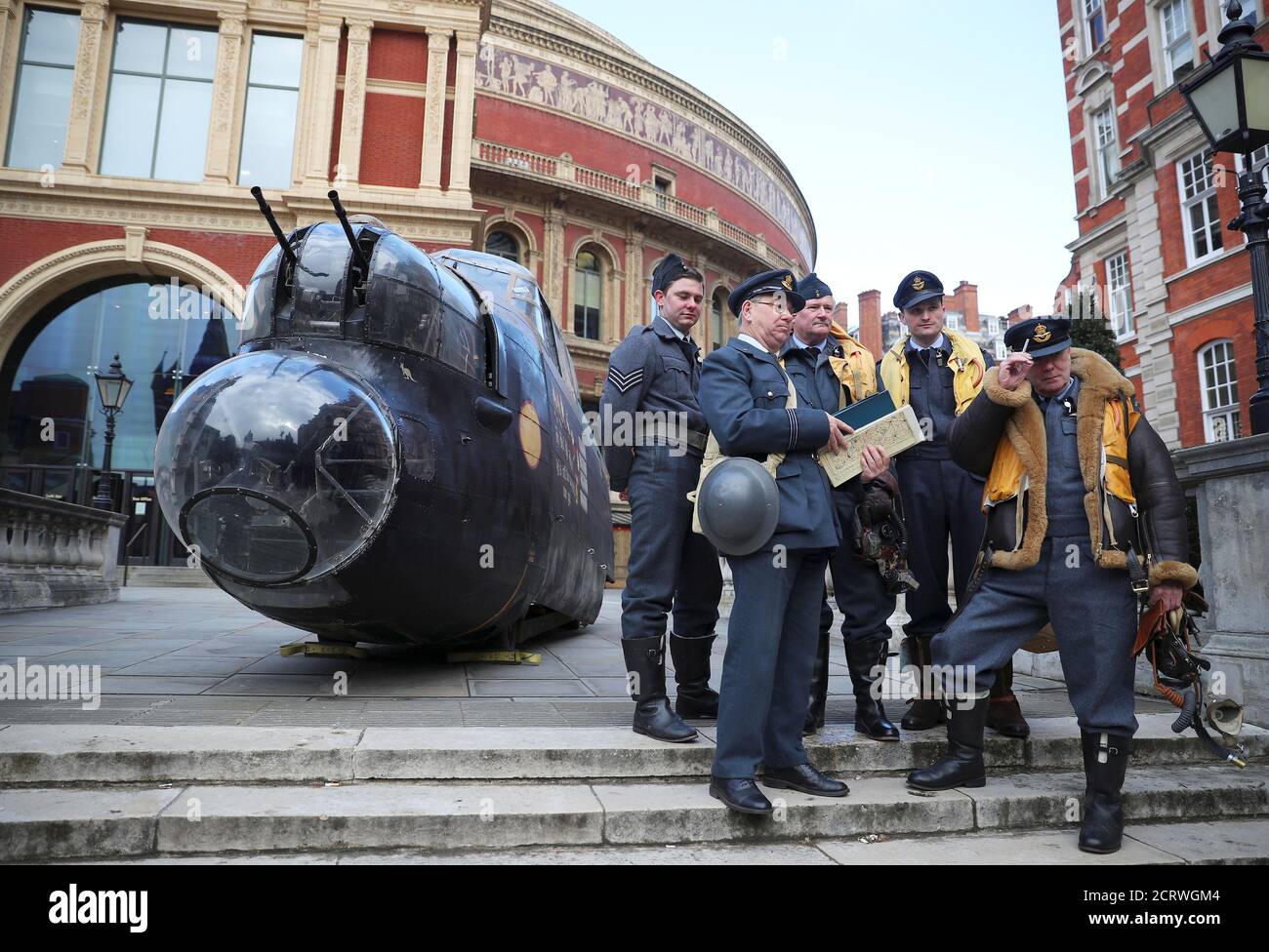 Military reenactors pose next to a model of the cockpit of a Lancaster bomber as they promote events to mark the 75th anniversary of the Dambuster raids to raise money for the RAF Benevolent Fund, outside the Royal Albert Hall in London, Britain, February 26, 2018. REUTERS/Hannah Mckay Stock Photo