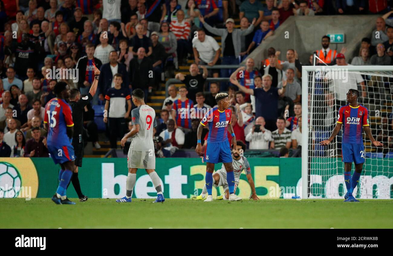 Soccer Football - Premier League - Crystal Palace v Liverpool - Selhurst Park, London, Britain - August 20, 2018  Crystal Palace's Aaron Wan-Bissaka is shown a red card by the referee after conceding a foul against Liverpool's Mohamed Salah                        Action Images via Reuters/John Sibley  EDITORIAL USE ONLY. No use with unauthorized audio, video, data, fixture lists, club/league logos or 'live' services. Online in-match use limited to 75 images, no video emulation. No use in betting, games or single club/league/player publications.  Please contact your account representative for f Stock Photo