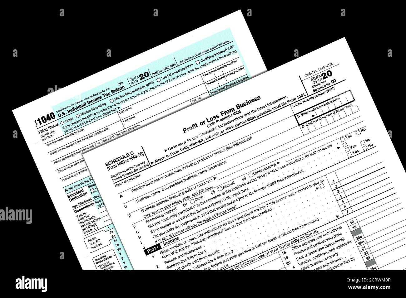 2020 IRS tax forms on a desktop. Stock Photo