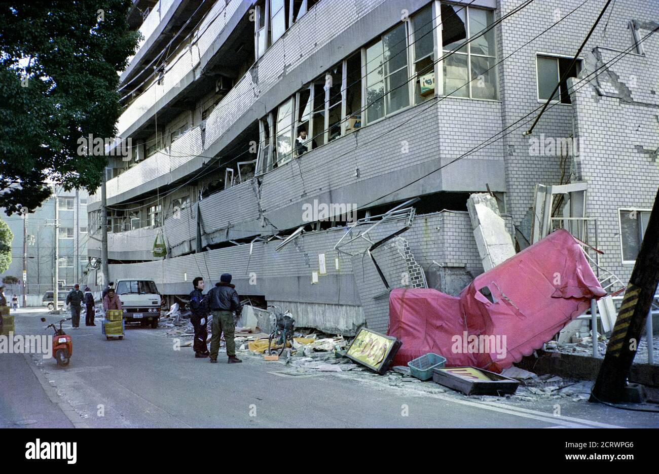 Collapsed apartment complex in the aftermath of the 1995 Great Hanshin Earthquake in Kobe, Japan Stock Photo