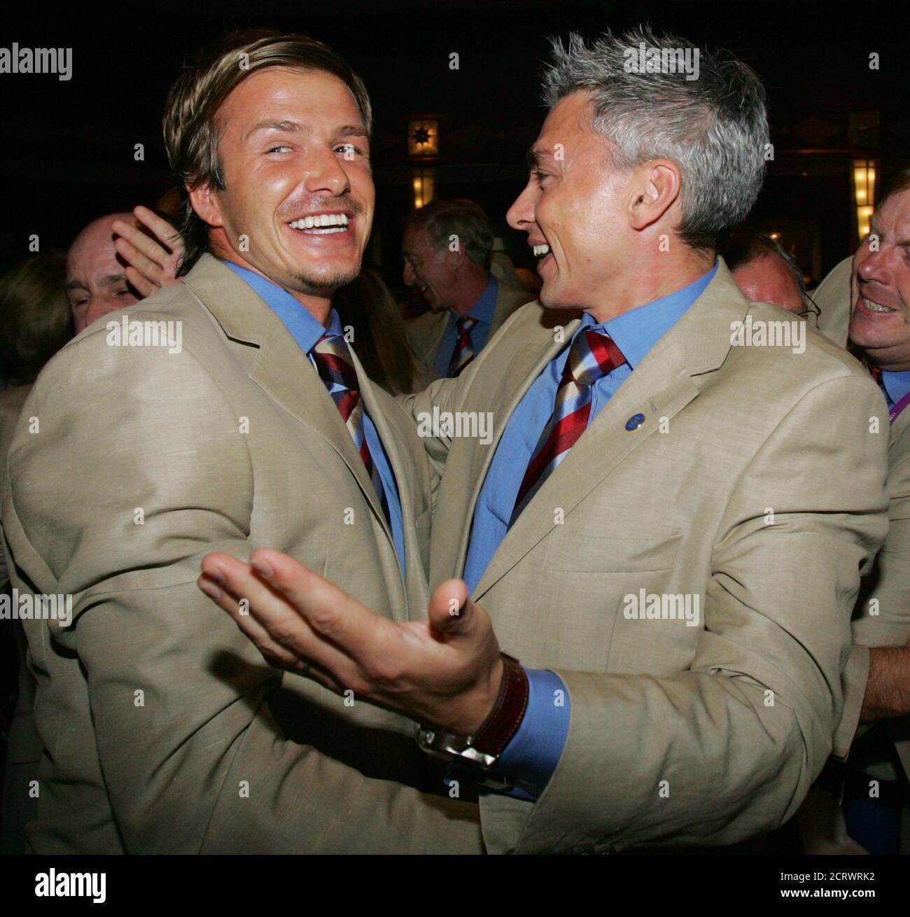 England S Soccer Captain David Beckham L And Olympic Gold Medalist Jonathan Edwards Embrace After International Olympic
