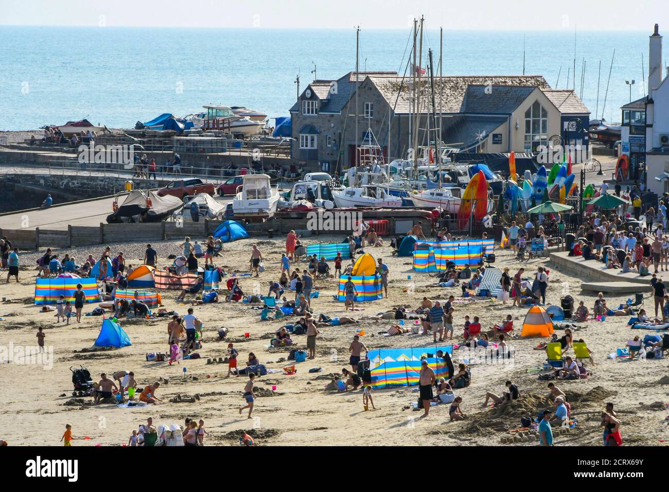 Lyme Regis, Dorset, UK. 20th September 2020. UK Weather. Sunbathers