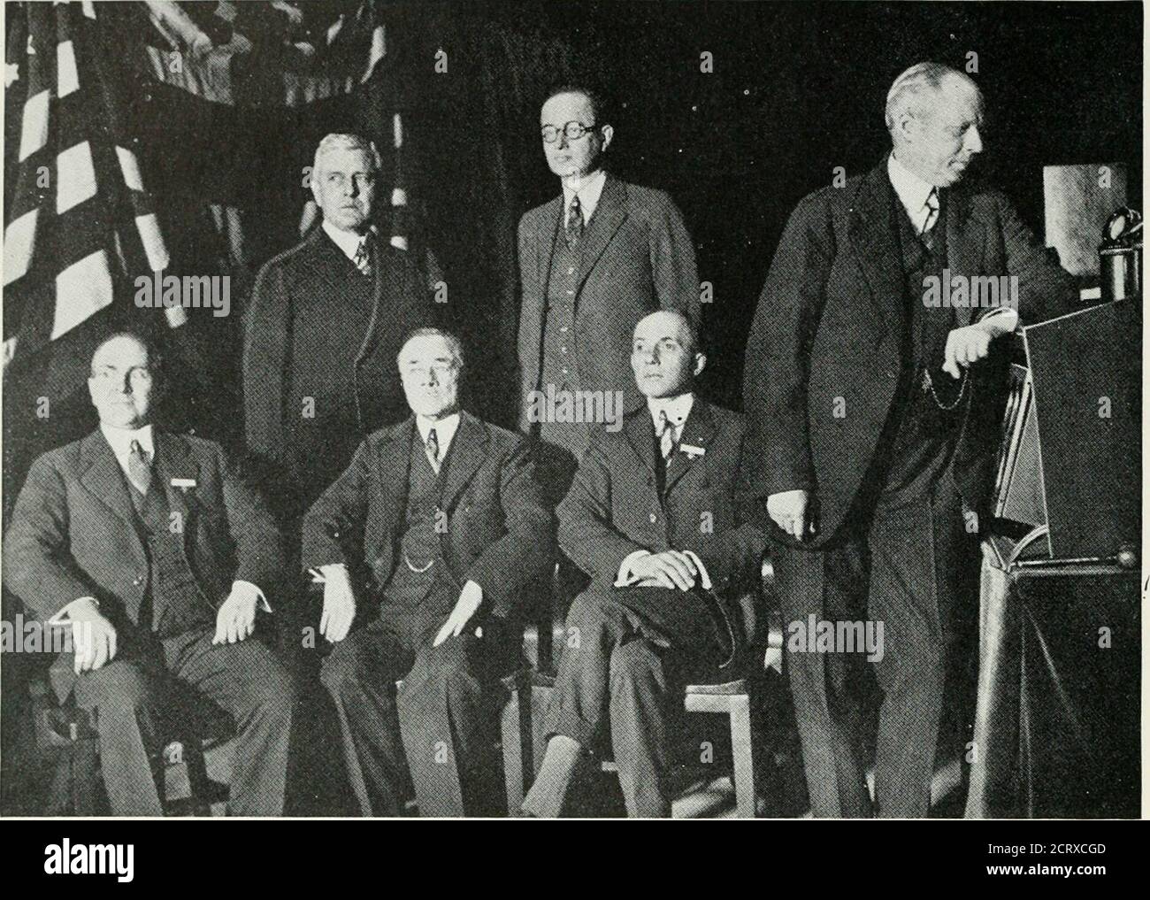 . Bell telephone magazine . Q f//r^X Twenty-five Years Ago in the Bell TelephoneQuarterly: Volume VII, Number 2. A. T. ^ T. officials at an A. I. E. E. session in New York on February i6, 1^28,held jointly with a session of the British Institution of Electrical Engineers in Londonby radio telephone. Left to rights seated: H. P. Charlesworth, Plant Engineer; J. J.Carty, Vice President; F. B. jewett. Vice President, President of Bell Laboratories;standing—K. W. Waterson^, Assistant Vice President; 0. B. Blackwell, Trans?nissionDevelopment Engineer; Bancroft Gherardi, Vice President and Chief En Stock Photo