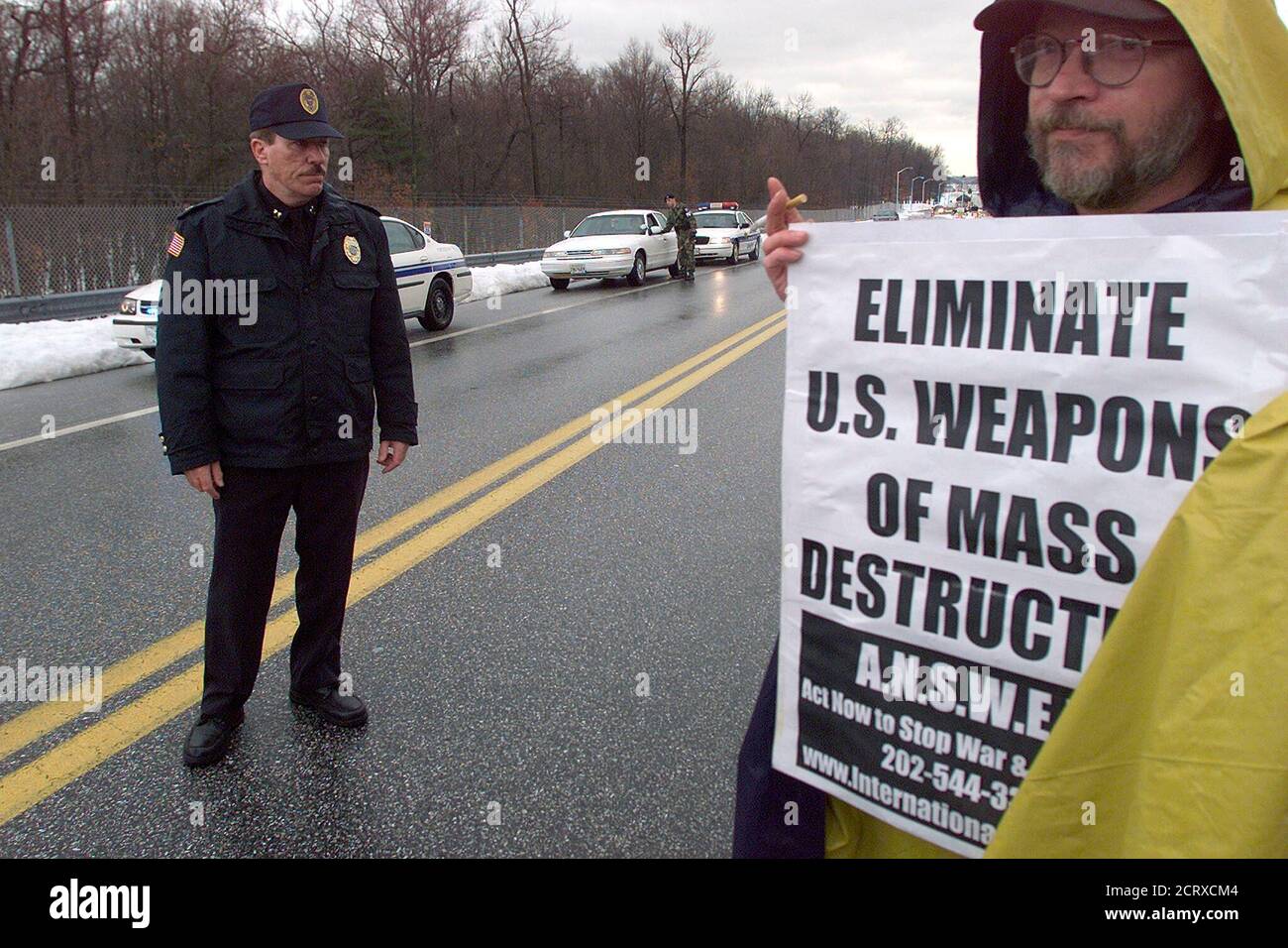An anti-war protester stands outside the entrance to The Aberdeen Proving Grounds, the U.S. military facility that tests and develops chemical weapons, February 23, 2003. Authorities turned the group away. REUTERS/Brendan McDermid  BM/ME Stock Photo
