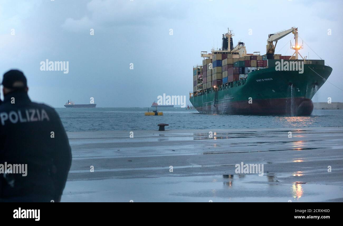The "Spirit of Piraeus " cargo container ship, transporting passengers from the car ferry Norman Atlantic after it caught fire in waters off Greece, is pictured after arriving at Bari harbour December 29, 2014. Rescue teams working through the night have pulled 265 people off a stricken car ferry which caught fire off the coast of Greece but more than 200 are stranded on board, the Italian navy said on Monday. REUTERS/Yara Nardi ( ITALY - Tags: DISASTER MARITIME) Stock Photo