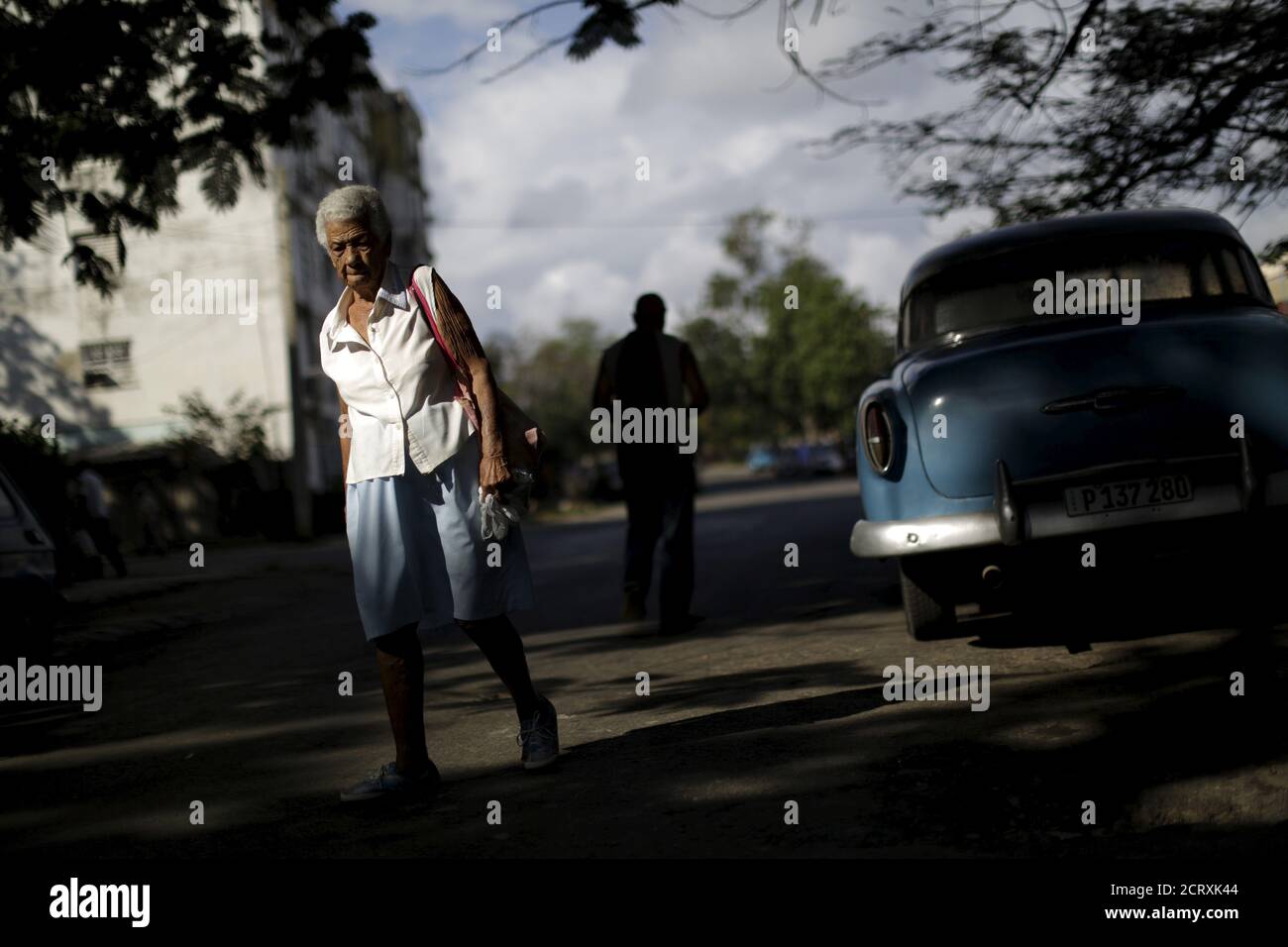 A woman walks on a street at the Alamar neighborhood in Havana, Cuba March 19, 2016. REUTERS/Ueslei Marcelino Stock Photo