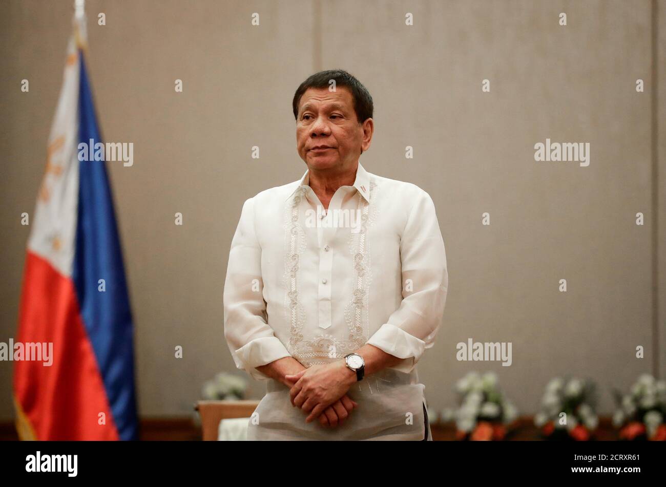 Philippines 'President Rodrigo Duterte stands at attention during a courtesy call with the Association of Southeast Asian Nations (ASEAN) Economic Ministers in Manila, Philippines, September 6, 2017.    REUTERS/Pool/Mark Cristino Stock Photo