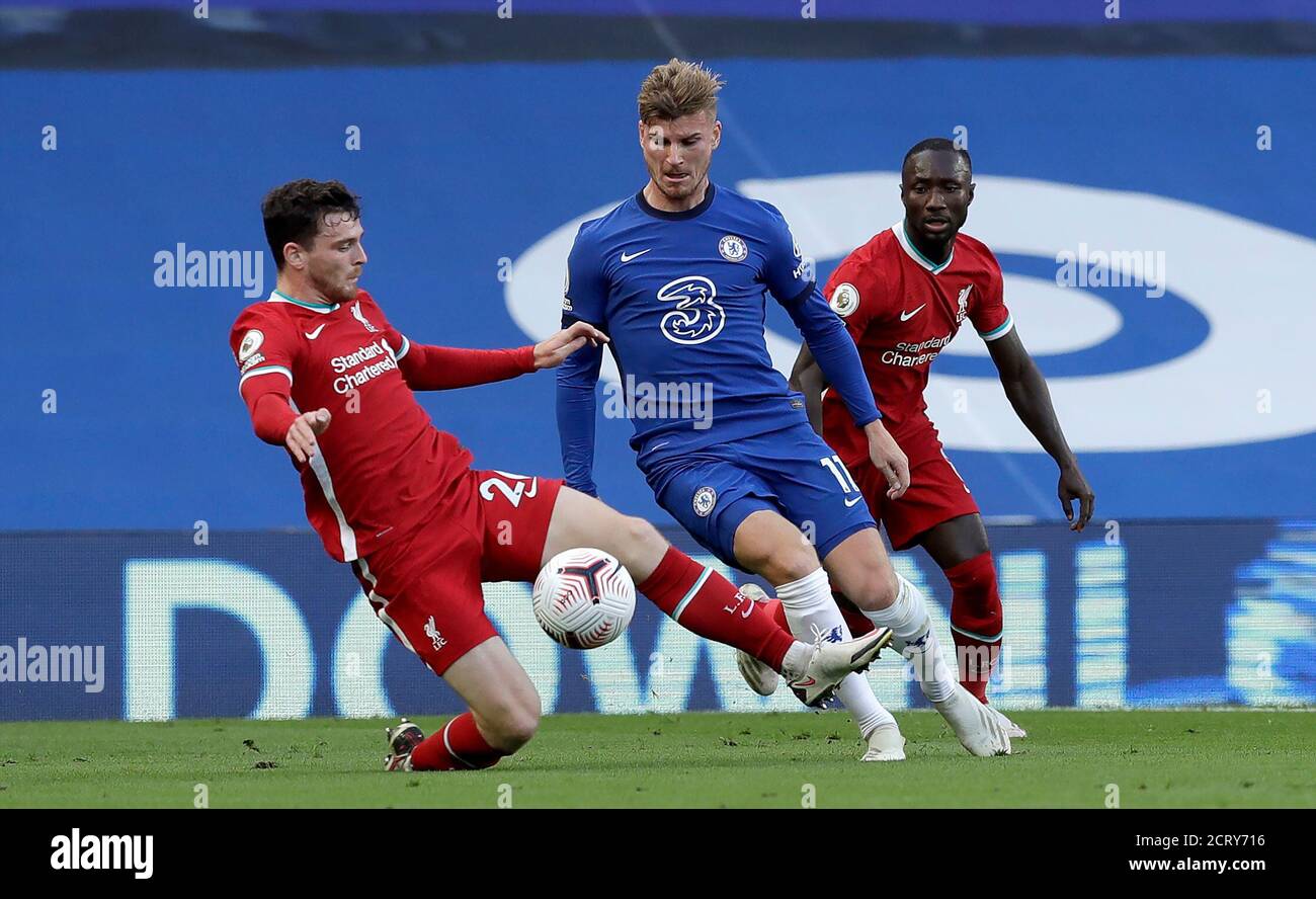 Liverpools Andrew Robertson (left) and Chelseas Timo Werner battle for the ball during the Premier League match at Stamford Bridge, London Stock Photo