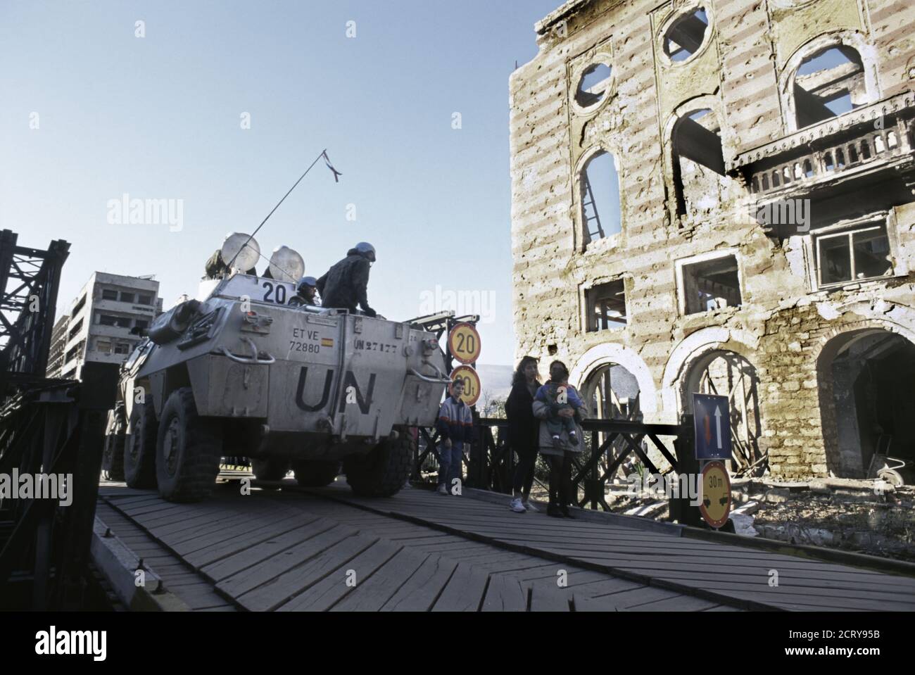 10th December 1995 During the war in Bosnia: a Spanish Army Santa Barbara VEC (Cavalry Scout Vehicle), part of the UNPROFOR contingent, crosses a temporary bridge on Mostarskog bataljona street in Mostar. Stock Photo