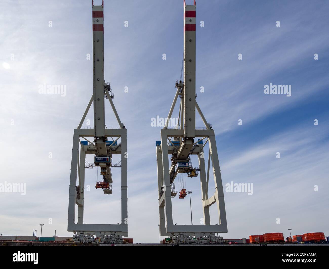 in a port there are cranes for loading and unloading ships Stock Photo ...