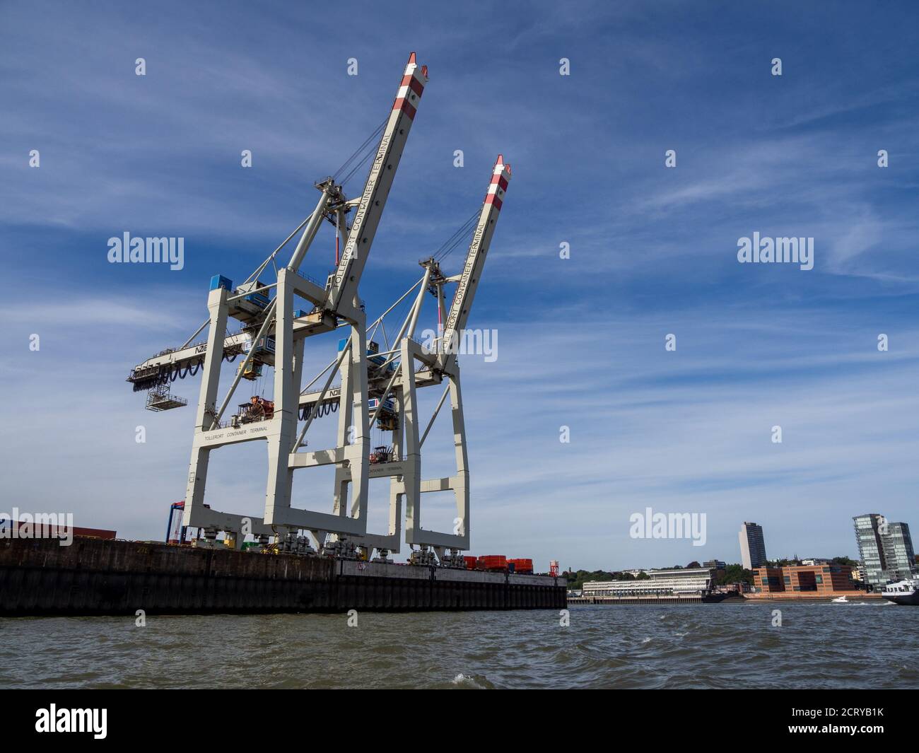in a port there are cranes for loading and unloading ships Stock Photo ...