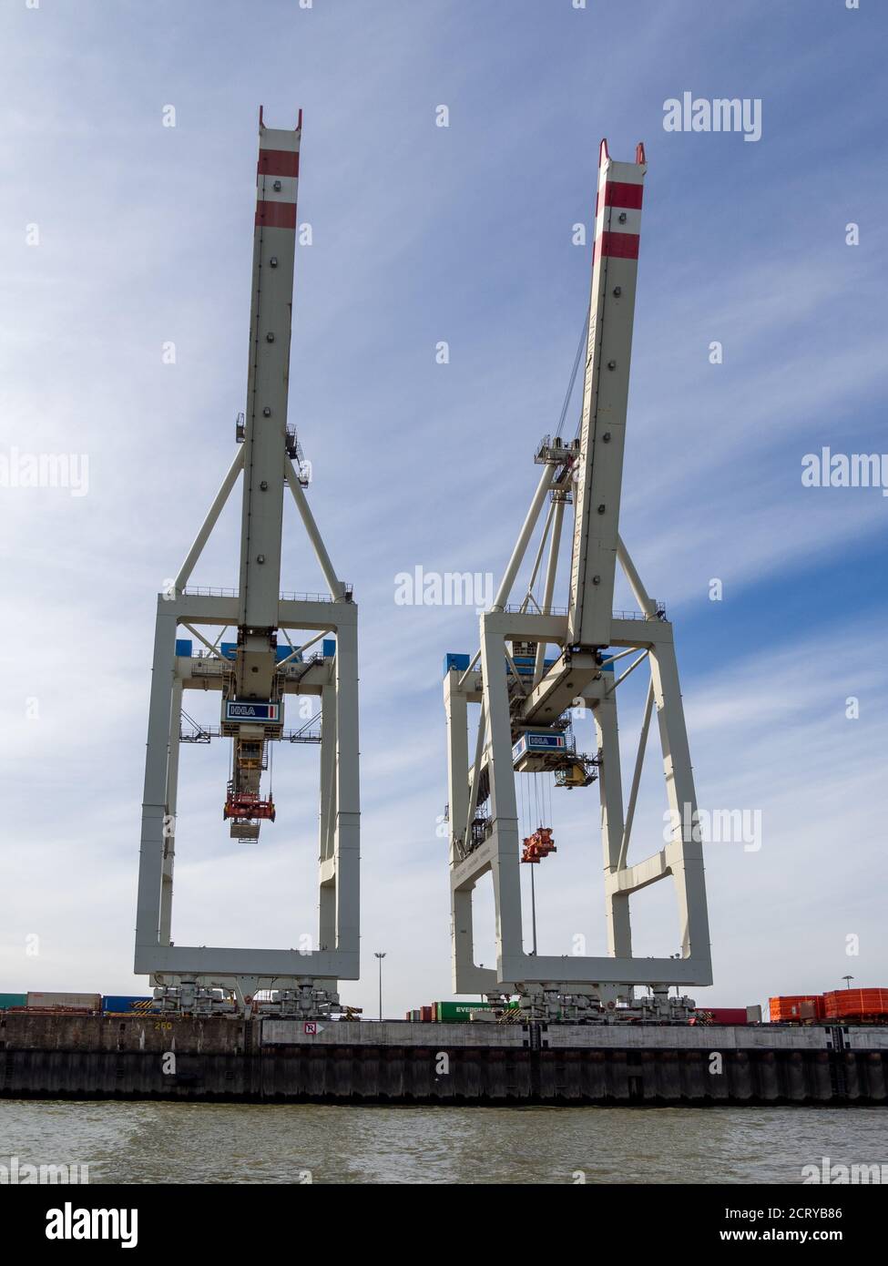 in a port there are cranes for loading and unloading ships Stock Photo ...