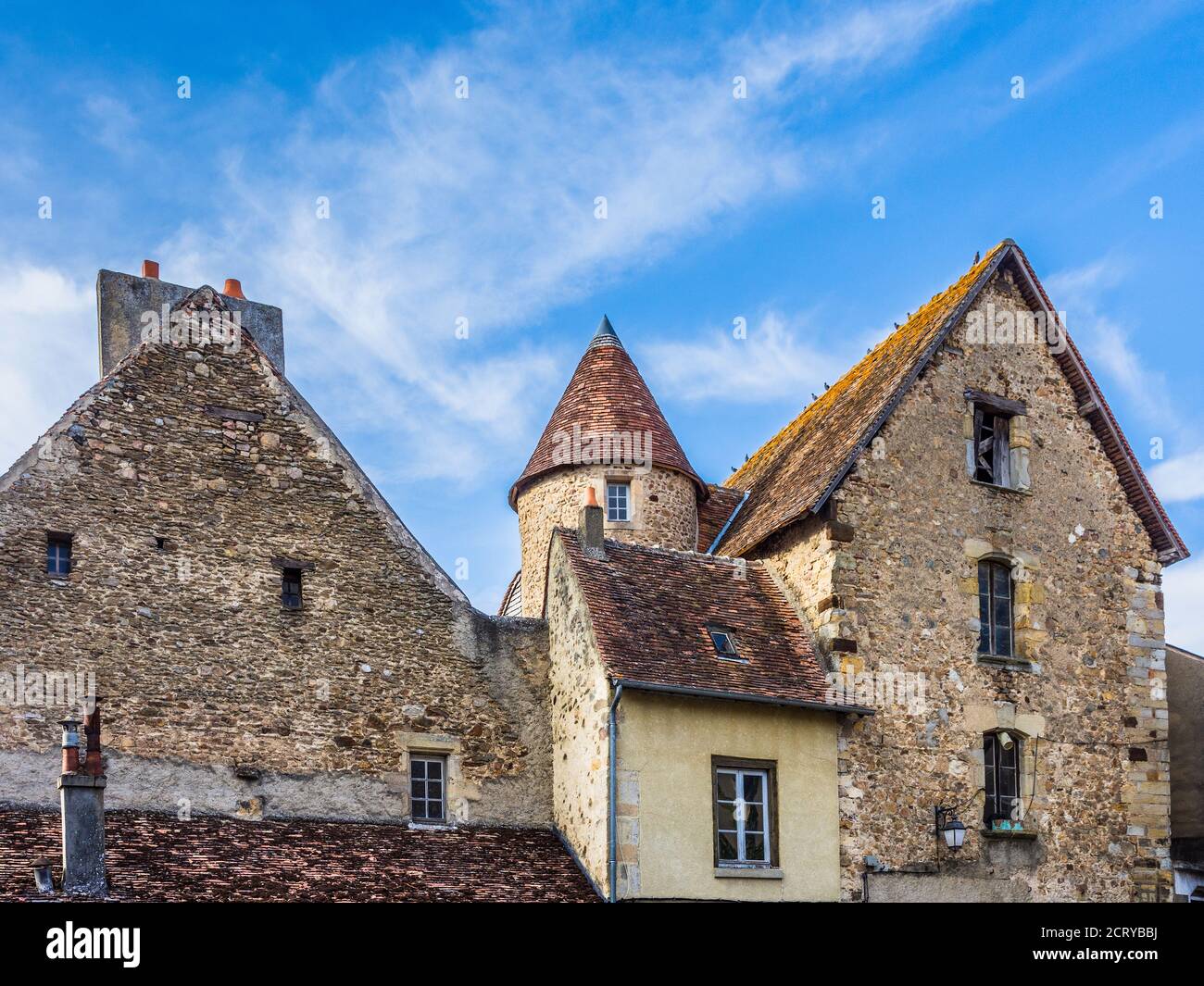 Rear of old stone domestic buildings in Saint-Benoit-du-Sault, Indre (36), France. Stock Photo