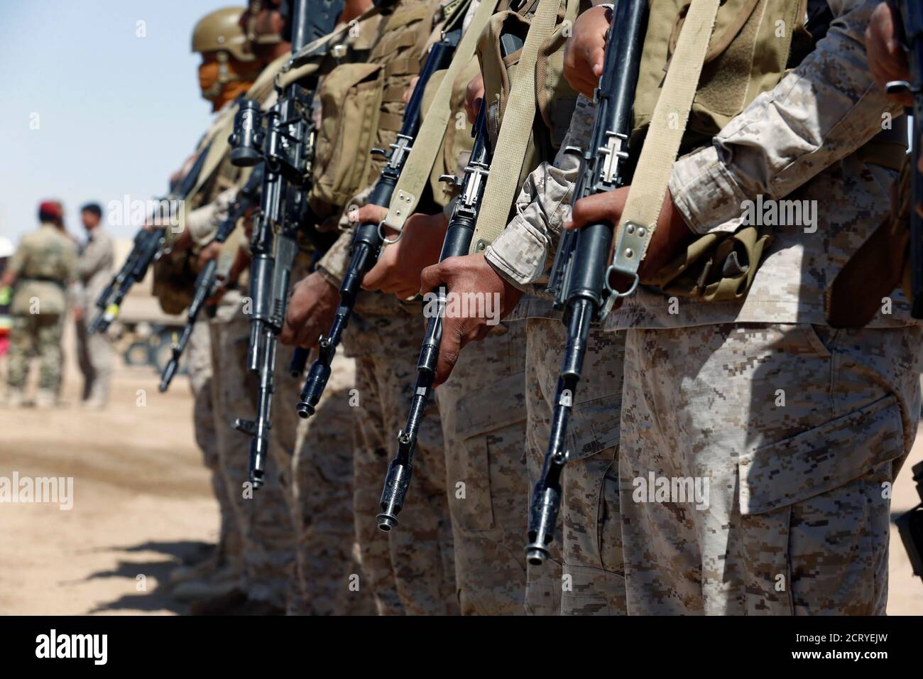 Saudi soldiers stand in line at an airfield where Saudi military cargo planes land to deliver aid in Marib, Yemen January 26, 2018. Picture taken January 26, 2018. REUTERS/Faisal Al Nasser Stock Photo
