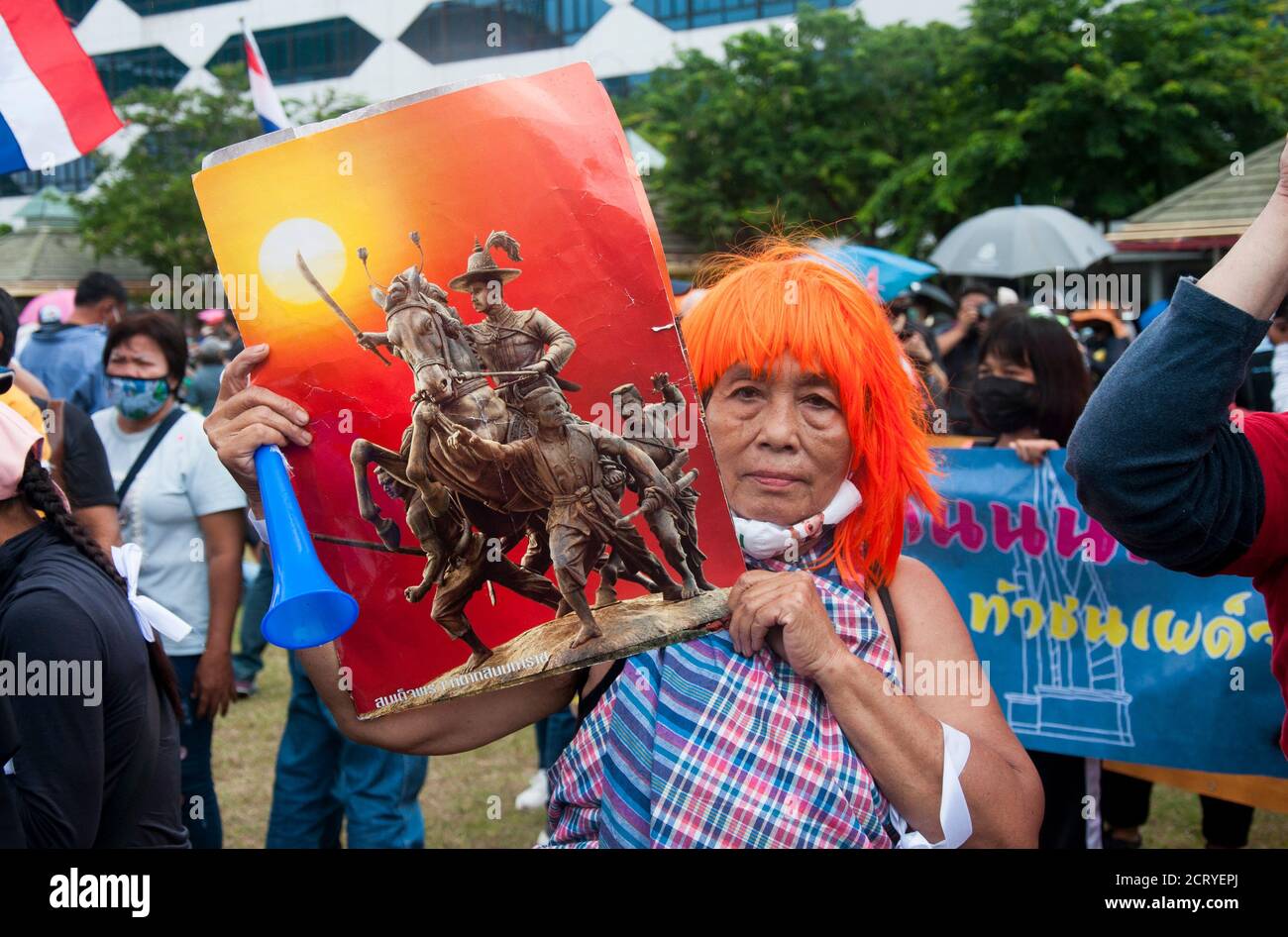 A protester holds a placard of 'Taksin the great'. The king of Thonburi kingdom who was a leader in the liberation of Siam from Burmese occupation after the Second Fall of Ayutthaya in 1767 during the demonstration at the Sanam Luang.Pro-democracy protesters converged at the historic royal heart of Bangkok to demand the resignation of the military-backed government and reforms of the monarchy, long considered a taboo subject in Thailand. The demonstrators gathered first at the Thammasat university campus on a college football field that was the scene of a massacre of left-wing students by pro- Stock Photo