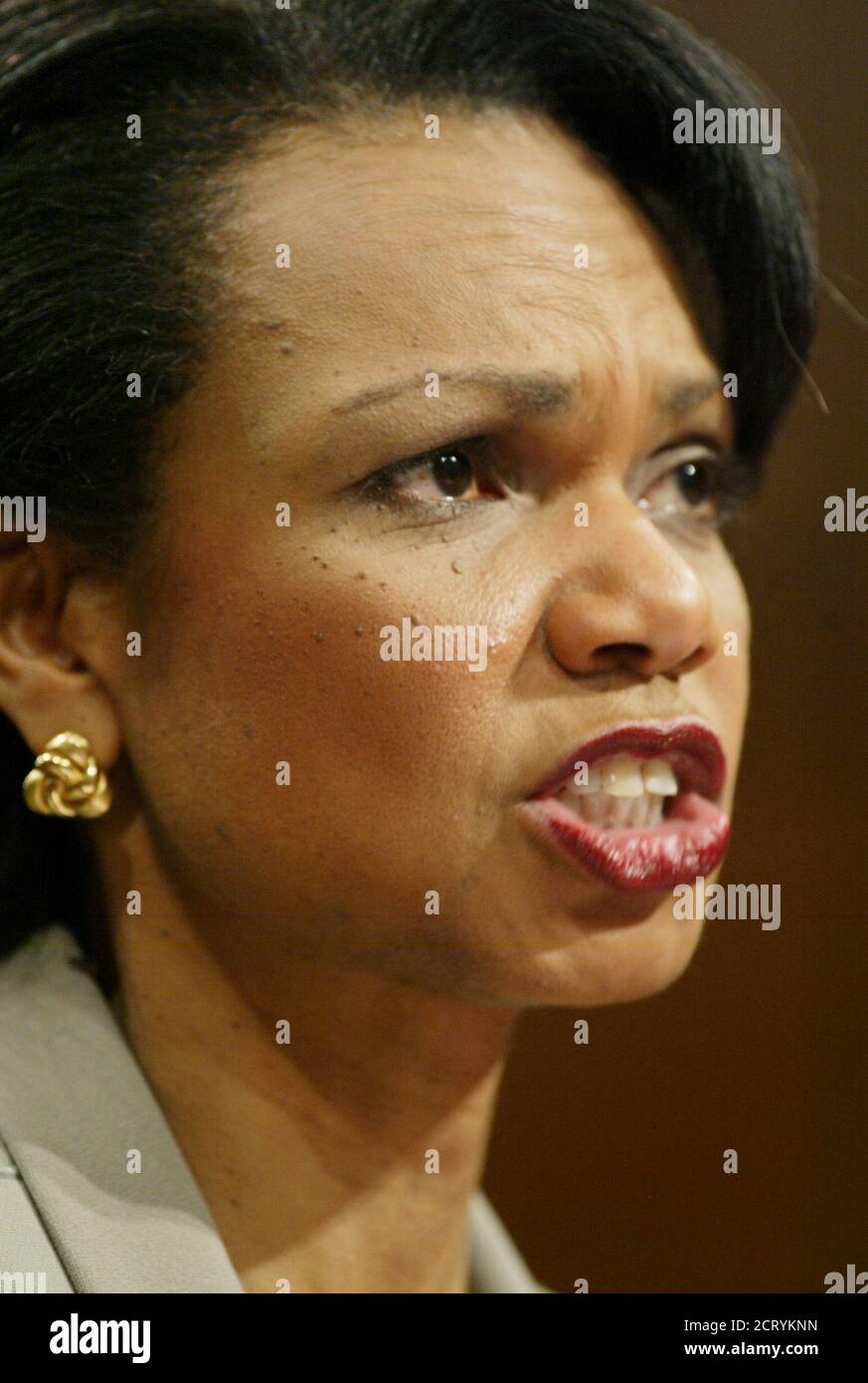 U.S. National Security Advisor Condoleezza Rice responds to a question during testimony before the 9-11 commission in the Hart Senate office building on Capitol Hill in Washington April 8, 2004. Rice on Thursday told the commission investigating the Sept. 11 attacks the U.S. government's response to the terrorism threat was insufficient across several administrations. REUTERS/Jim Bourg  MR Stock Photo