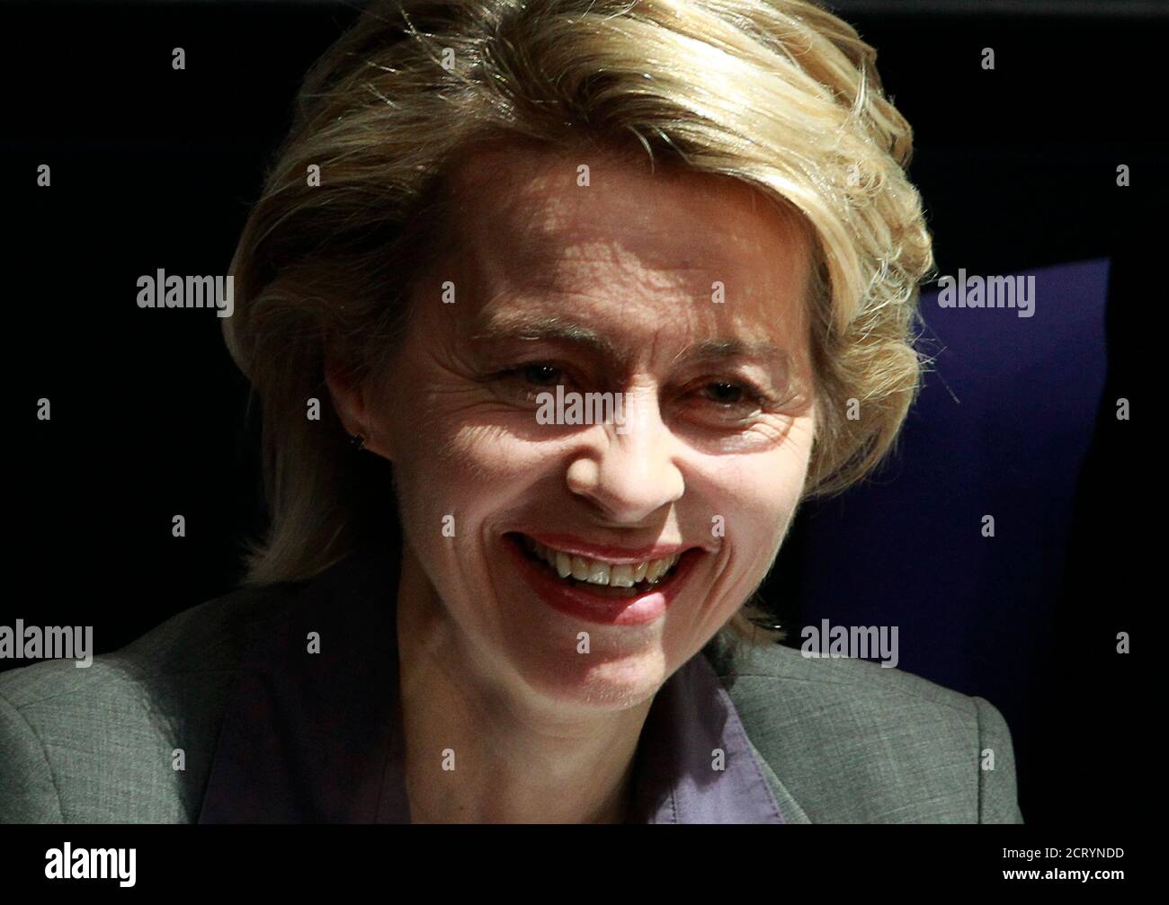 German Labour Minister Ursula von der Leyen smiles after the lower house of parliament, the Bundestag, voted on a reform of the minimum jobseekers allowance Hartz IV, in Berlin, February 25, 2011. REUTERS/Thomas Peter  (GERMANY - Tags: POLITICS HEADSHOT) Stock Photo