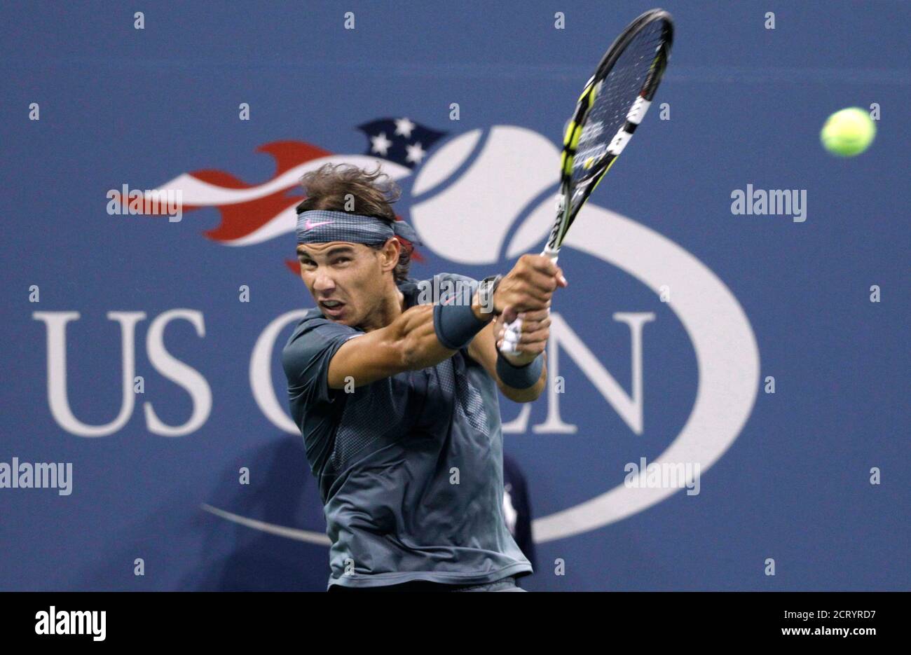 Rafael Nadal of Spain returns a volley to Rogerio Dutra Silva of Brazil at the U.S. Open tennis championships in New York, August 29, 2013. REUTERS/Shannon Stapleton (UNITED STATES - Tags: SPORT TENNIS) Stock Photo