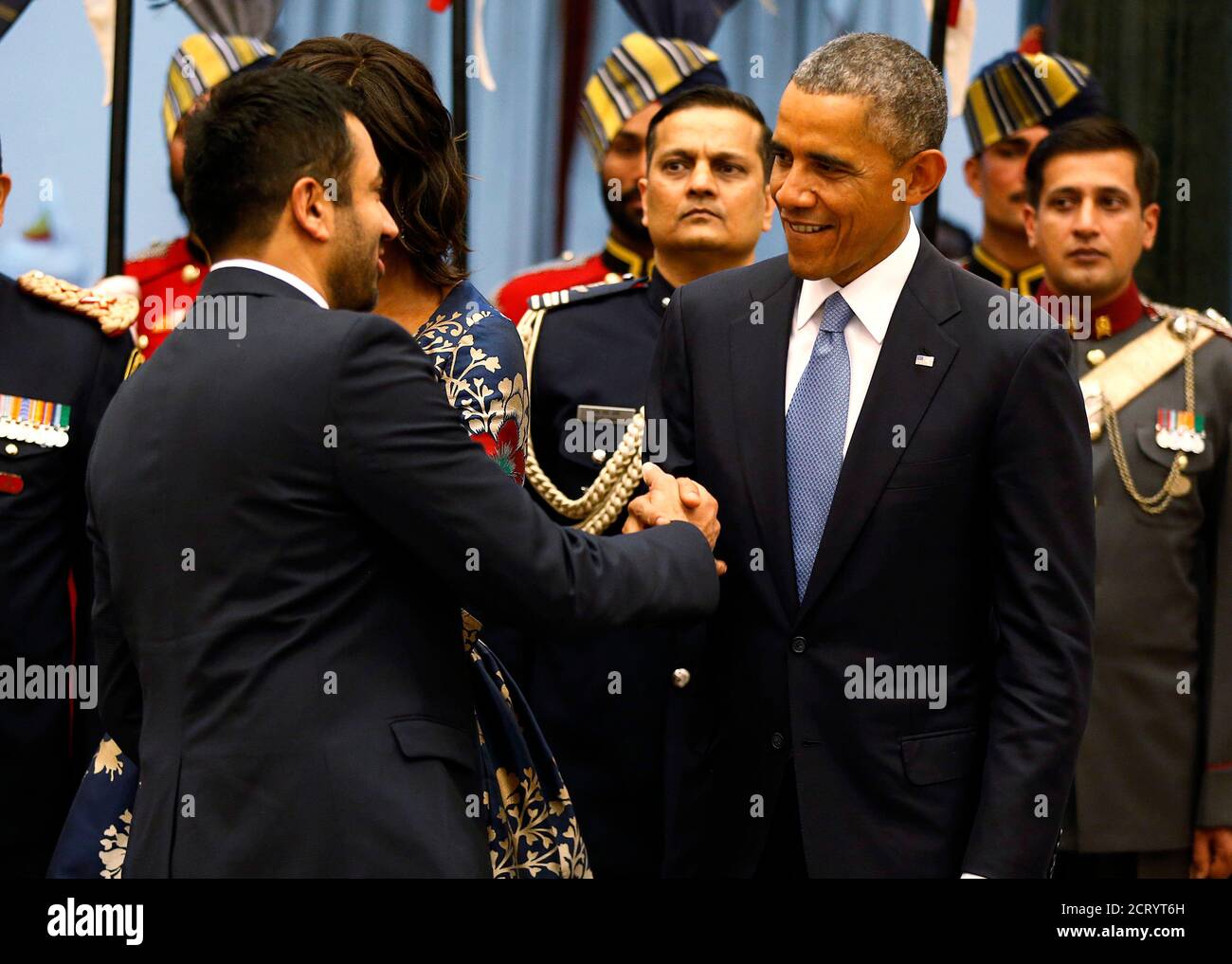 U.S. President Barack Obama talks with Indian American movie actor and  former Obama administration official Kal Penn (originally named Kalpen  Suresh Modi) as Obama participates in a receiving line before a State