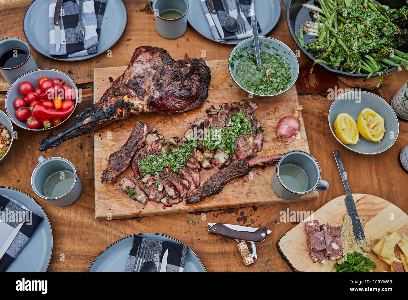 Summer Barbecue Spread with Steak, Venison and Chimichurri Stock Photo