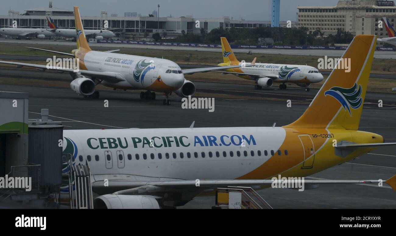 Cebu Pacific passenger jets are pictured at the tarmac of Terminal 3 at the Ninoy Aquino International aiport in Pasay city, Metro Manila Philippines April 1, 2016. REUTERS/Erik De Castro Stock Photo