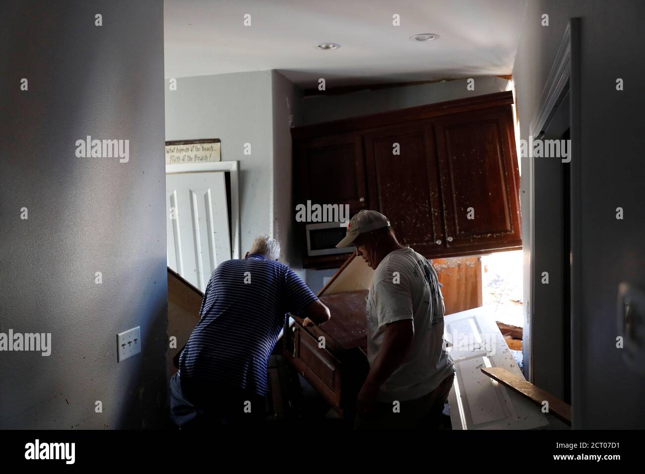 Charles Anderson, 76, (L) of Thomasville, GA, and Mark Drake, 55, of  Tallahassee, enter Anderson's vacation home damaged by Hurricane Michael in  Mexico Beach, Florida, U.S., October 16, 2018. REUTERS/Terray Sylvester  Stock Photo - Alamy