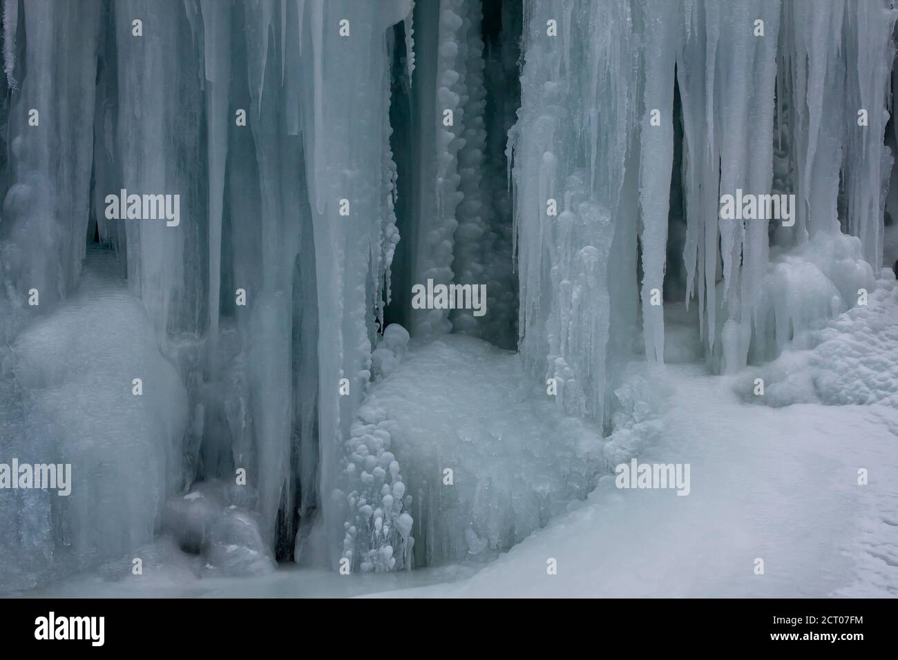 A high altitude frozen water fall with several patterns of icicles in Ladakh in India Stock Photo