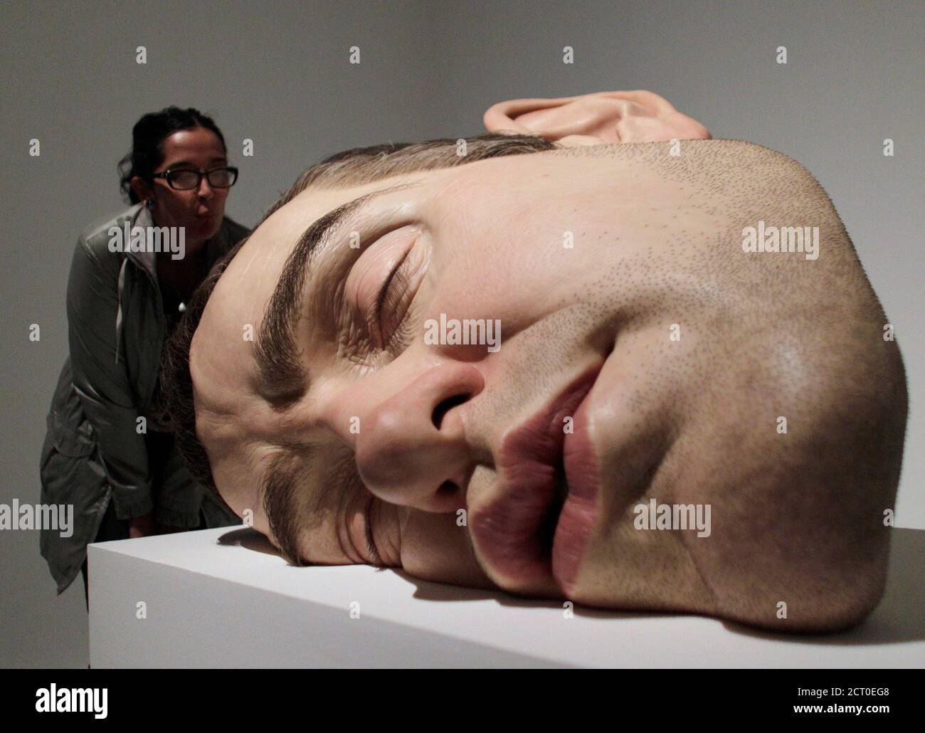 A visitor looks at a entitled "Mask II" by Australian sculptor Ron Mueck at the San Ildefonso Museum in Mexico City 20, 2011. Romero - Tags: SOCIETY Stock