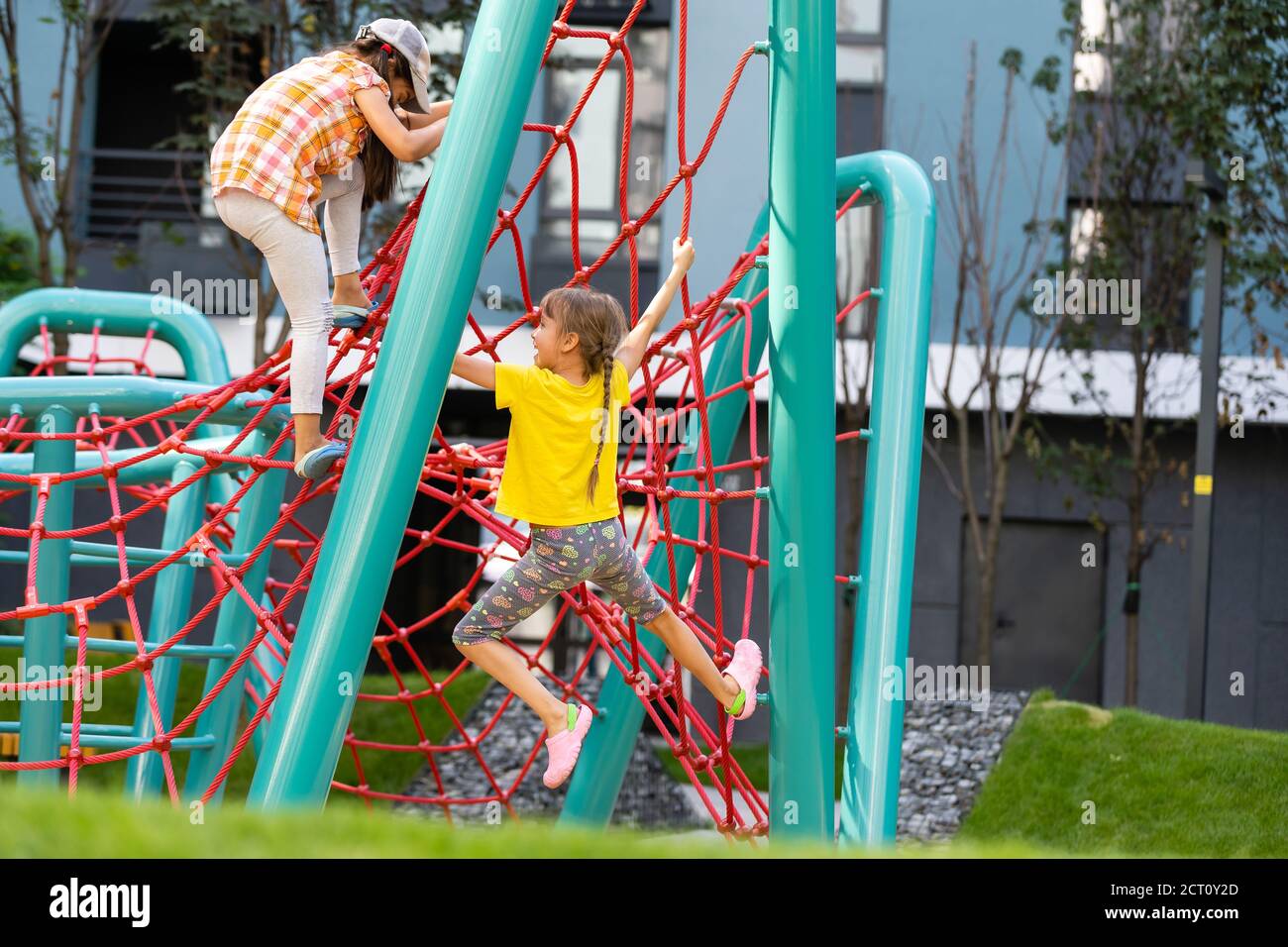Happy children playing outdoors, children on the playground Stock Photo ...