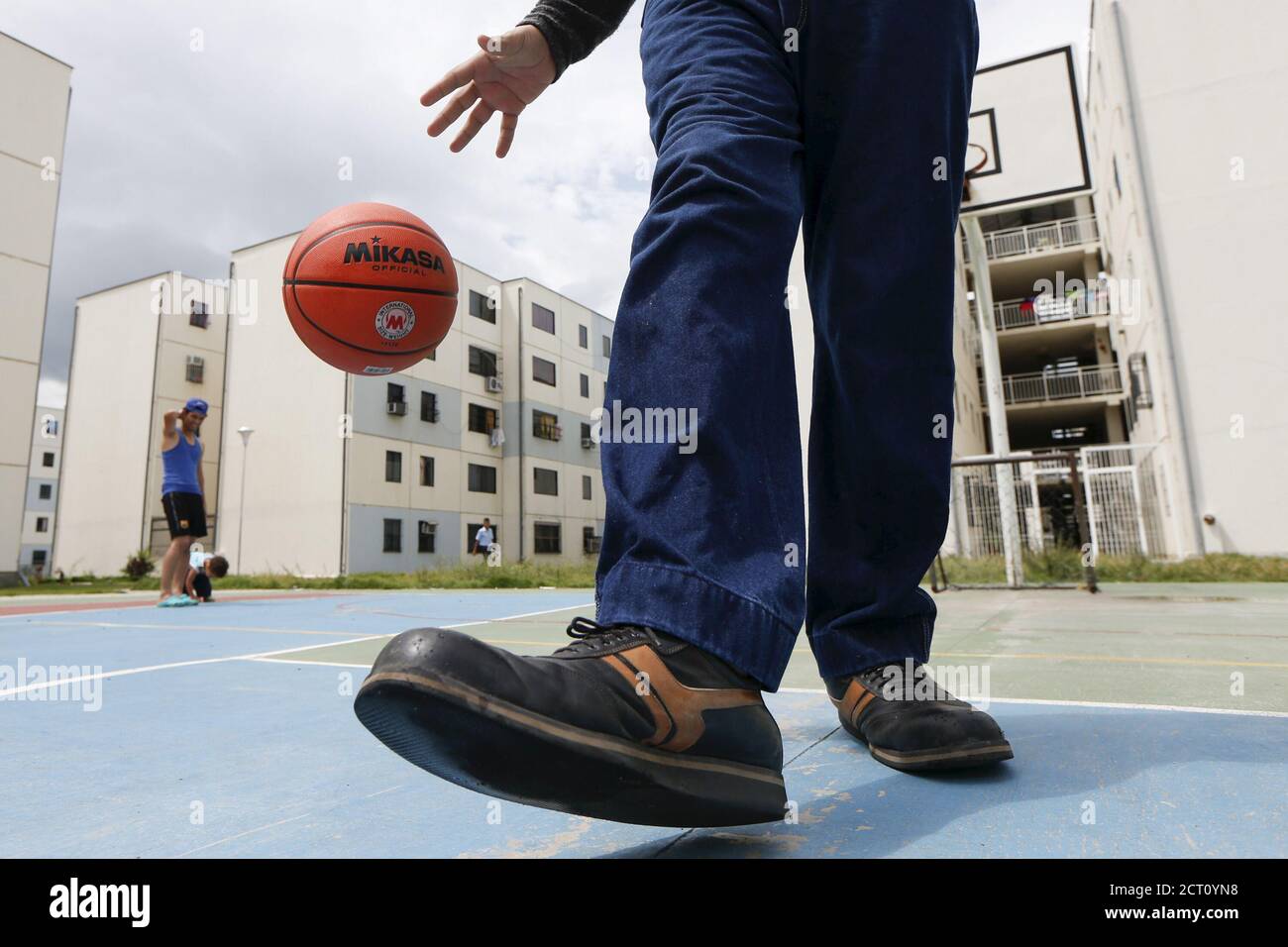 Jeison Rodriguez L 19 The Living Person With The Largest Feet In The World Poses For A Picture With His Older Brother Wilmer 24 Outside Their House In Maracay Venezuela October 14