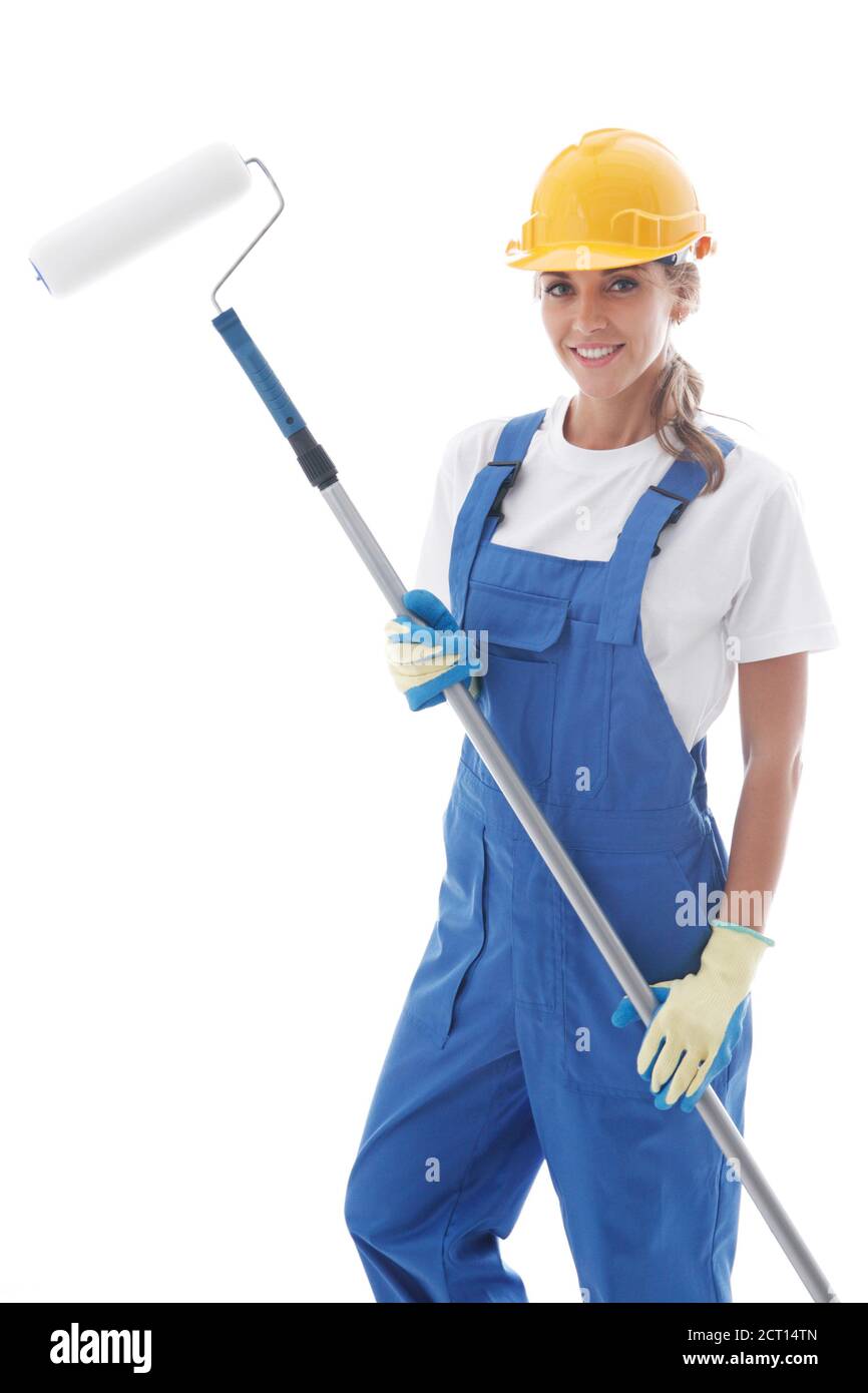 Female house painter in blue uniform coveralls and yellow hardhat with