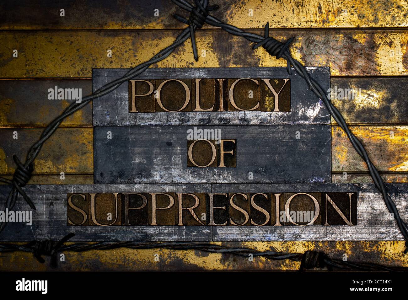 Policy of Suppression text message on textured grunge copper and vintage gold background Stock Photo