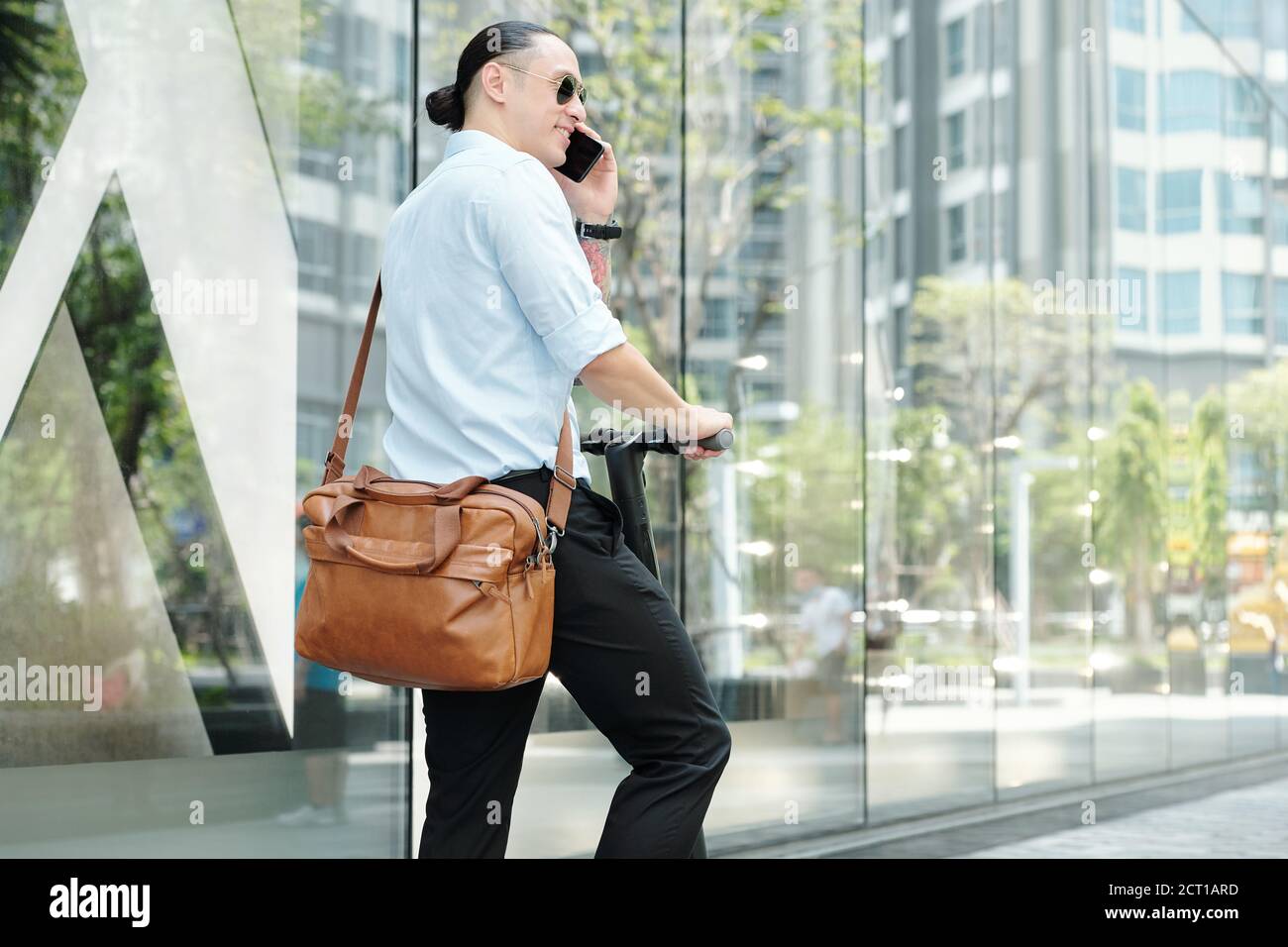 Young entrepreneur calling on phone Stock Photo